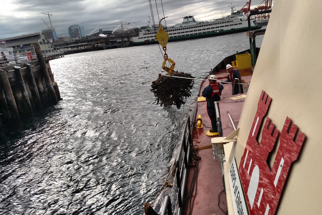 U.S. Army Corps of Engineers personnel pick up logs out of the Puget Sound near downtown Seattle, Oct. 3, 2016. The logs were potential threats to navigation.

The Corps has patrolled the Puget Sound to find and remove navigational hazards for more than a century. The vessel Puget's crew collects large pieces of drift, waterlogged pilings, logs considered a hazardous to navigation and other debris. The Puget’s crew pick up about 1,000 tons of debris each year and this represents about 2,000 hazards to navigation. 