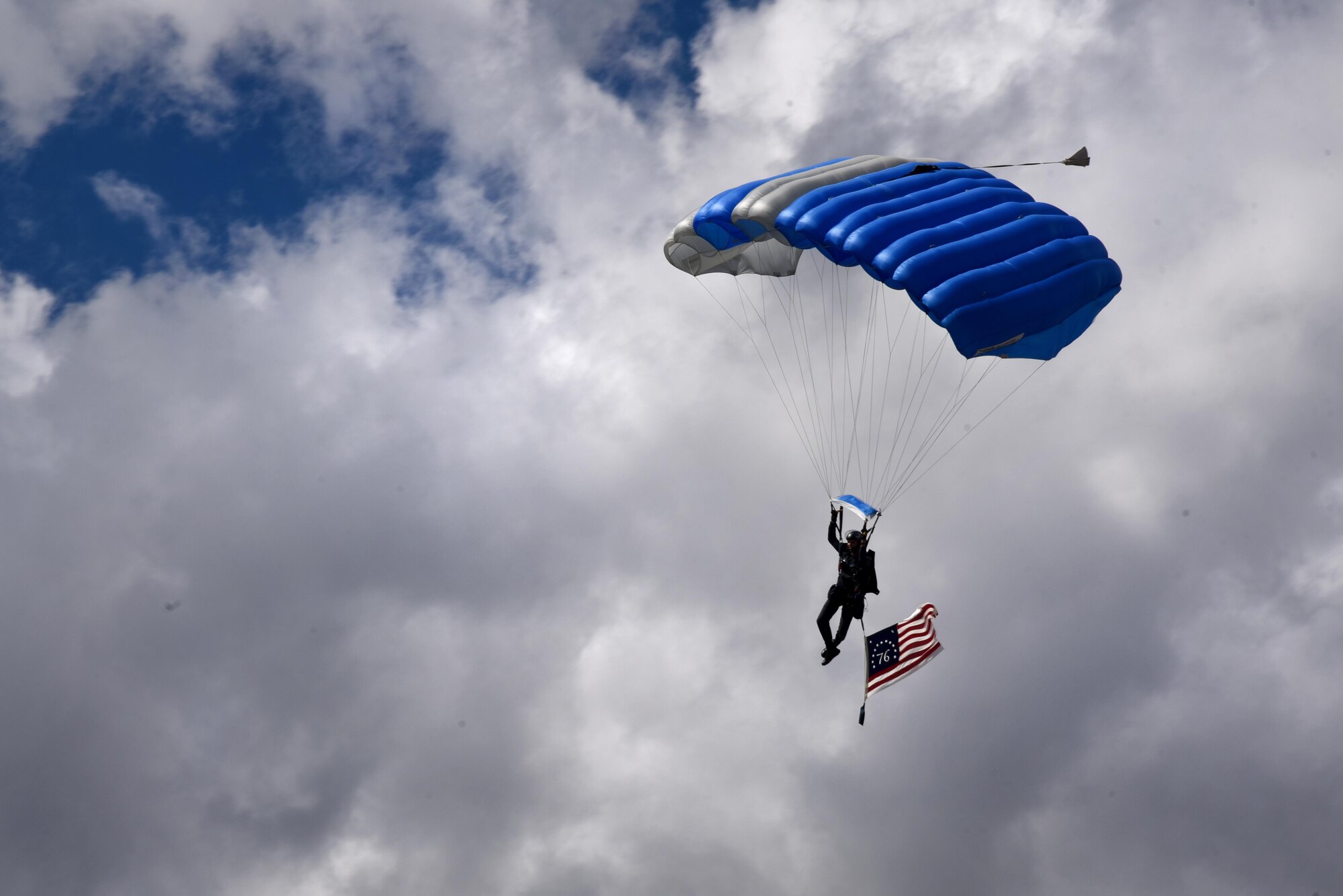 U.S. AIR FORCE ACADEMY, Colo. – A Wings of Blue skydiver parachutes into Falcon Stadium at the U.S. Air Force Academy, Colo., Oct. 1, 2016. The Wings of Blue has both a demonstration team and a competition team. The demonstration team travels across the country to airshows, sporting events, and other venues to represent the Air Force through precision parachuting. (U.S. Air Force photo by Airman 1st Class Dennis Hoffman)