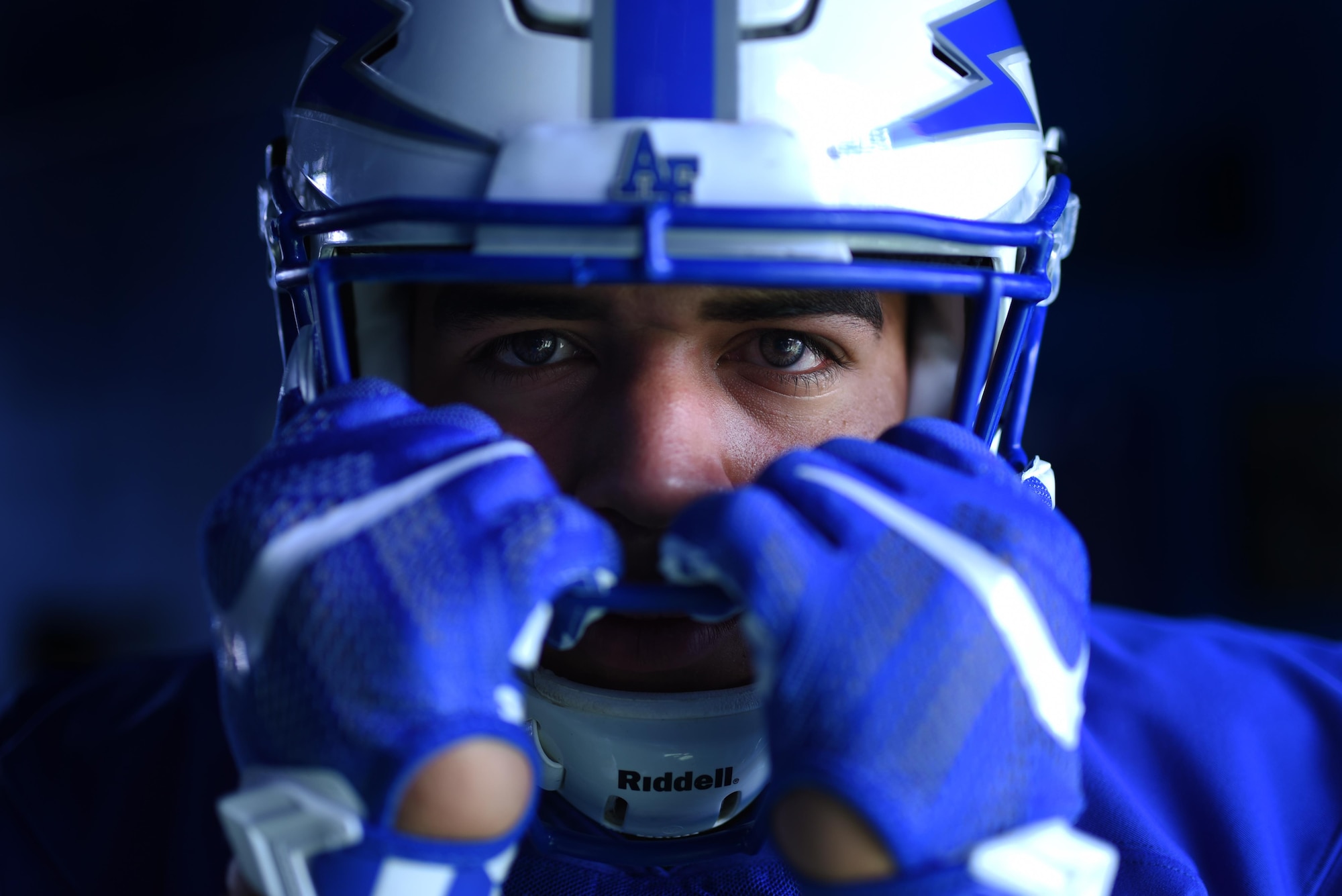 U.S. AIR FORCE ACADEMY, Colo. – Cadet 4th Class Corey Birdow, U.S. Air Force Academy football team fullback, suits up before the Air Force vs. Navy game in Falcon Stadium at the U.S. Air Force Academy, Colo., Oct. 1, 2016. The Army Black Knights, the Navy Midshipmen and Air Force Falcons compete in a triangular series for the Commander-in-Chief's Trophy, which is awarded to each season's winner. (U.S. Air Force photo by Airman 1st Class Dennis Hoffman)