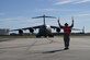 Col. Jimmy Canlas, 437th Airlift Wing commander, marshals in the first C-17 Globemaster III returning to Joint Base Charleston on Oct. 11 after evacuating for Hurricane Matthew. Many of the aircraft continued to perform various world-wide missions from their evacuated locations. 