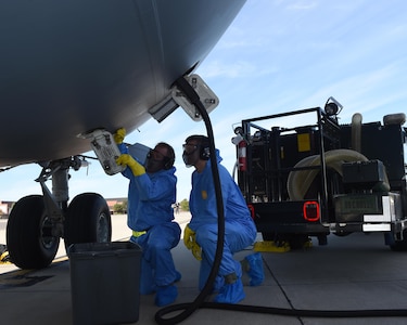 Staff Sgt. Joshua Orphan (left), 437th Aerial Port Squadron fleet service operations supervisor and Airman 1st Class Jake Slayton (right), 437th APS fleet service operator, drain waste water from a C-17 Globemaster III returning to Joint Base Charleston on Oct. 11 after evacuating for Hurricane Matthew. The aircraft was one of 28 evacuated from JB Charleston in preparation for the storm. 