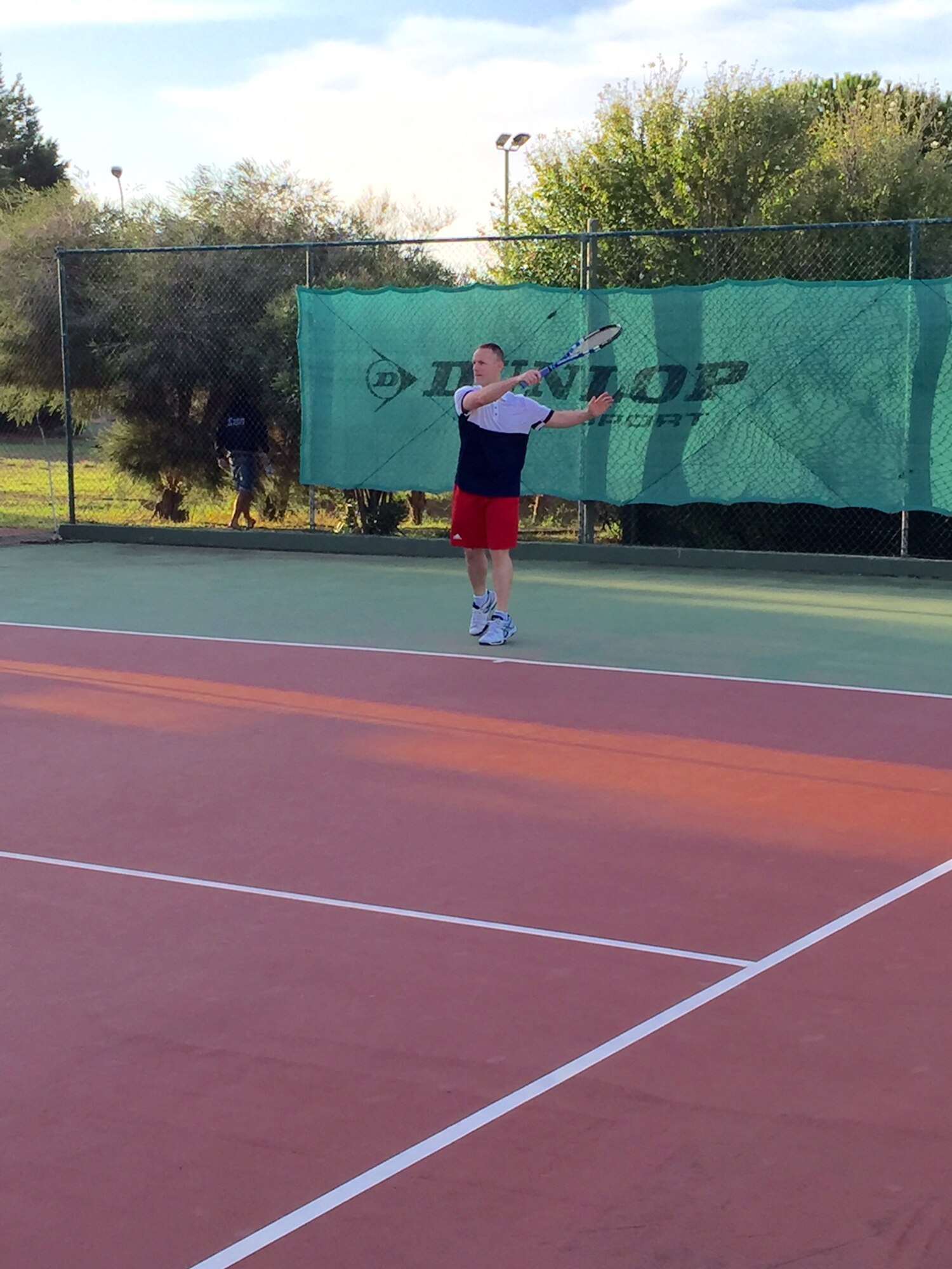 DECIMOMANNU AIR BASE, Sardinia -- Maj. Brian Mason, 21st Space Wing Judge Advocate General deputy staff judge advocate, warms up in preparation for a match at the Aircom Tennis Championship, Sept. 19-23 at Decimomannu Air Base, Sardinia. The tournament was held by Headquarters, Allied Air Component Command, the North Atlantic Treaty Organization’s air component, based at Ramstein Air Base, Germany. (Courtesy photo)