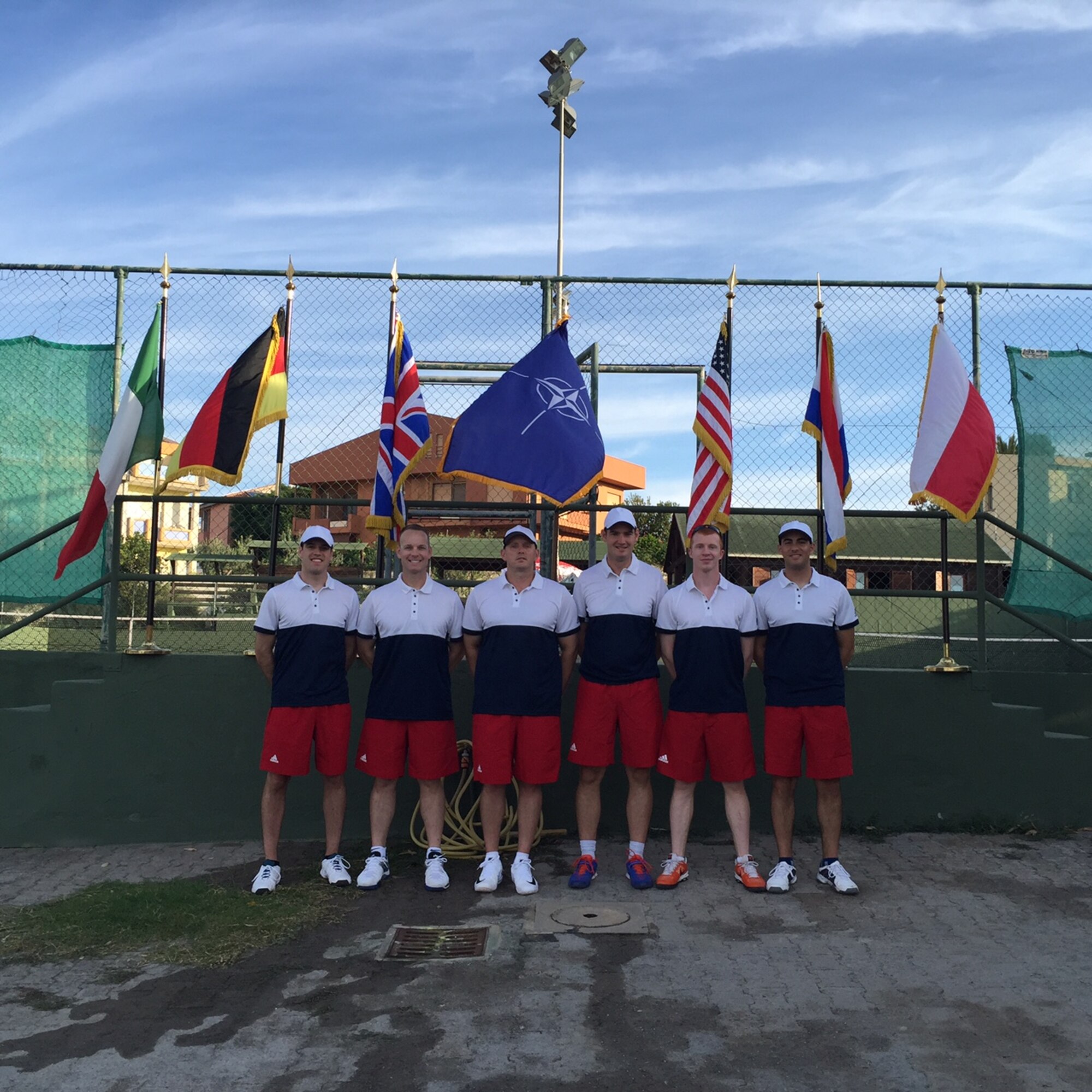 DECIMOMANNU AIR BASE, Sardinia -- Maj. Brian Mason, 21st Space Wing Judge Advocate General deputy staff judge advocate, second from left, and his teammates represented the Air Force in a multinational tennis tournament. The event was held Sept. 19-23 at Decimomannu Air Base, Sardinia. (Courtesy photo)