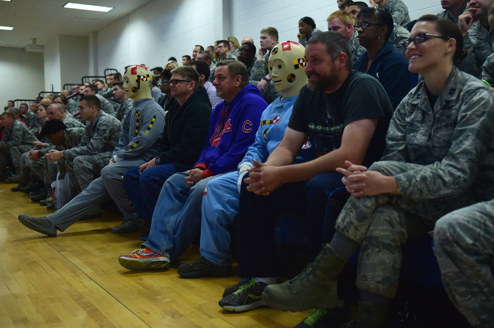 Two crash dummies sit with Team Buckley during a Safety Day event Oct. 7, 2016, at the fitness center on Buckley Air Force Base, Colo. The goal of the event was to bring subject matter experts to Buckley AFB to present important information about safety. (U.S. Air Force photo by Airman 1st Class Gabrielle Spradling/Released)
