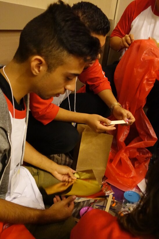 Students use their engineering skills to build props for "College Bowl" skits.  USACE was one of several organizations at the event to mentor and lead students during the conference’s most energetic, competitive and teambuilding workshops.