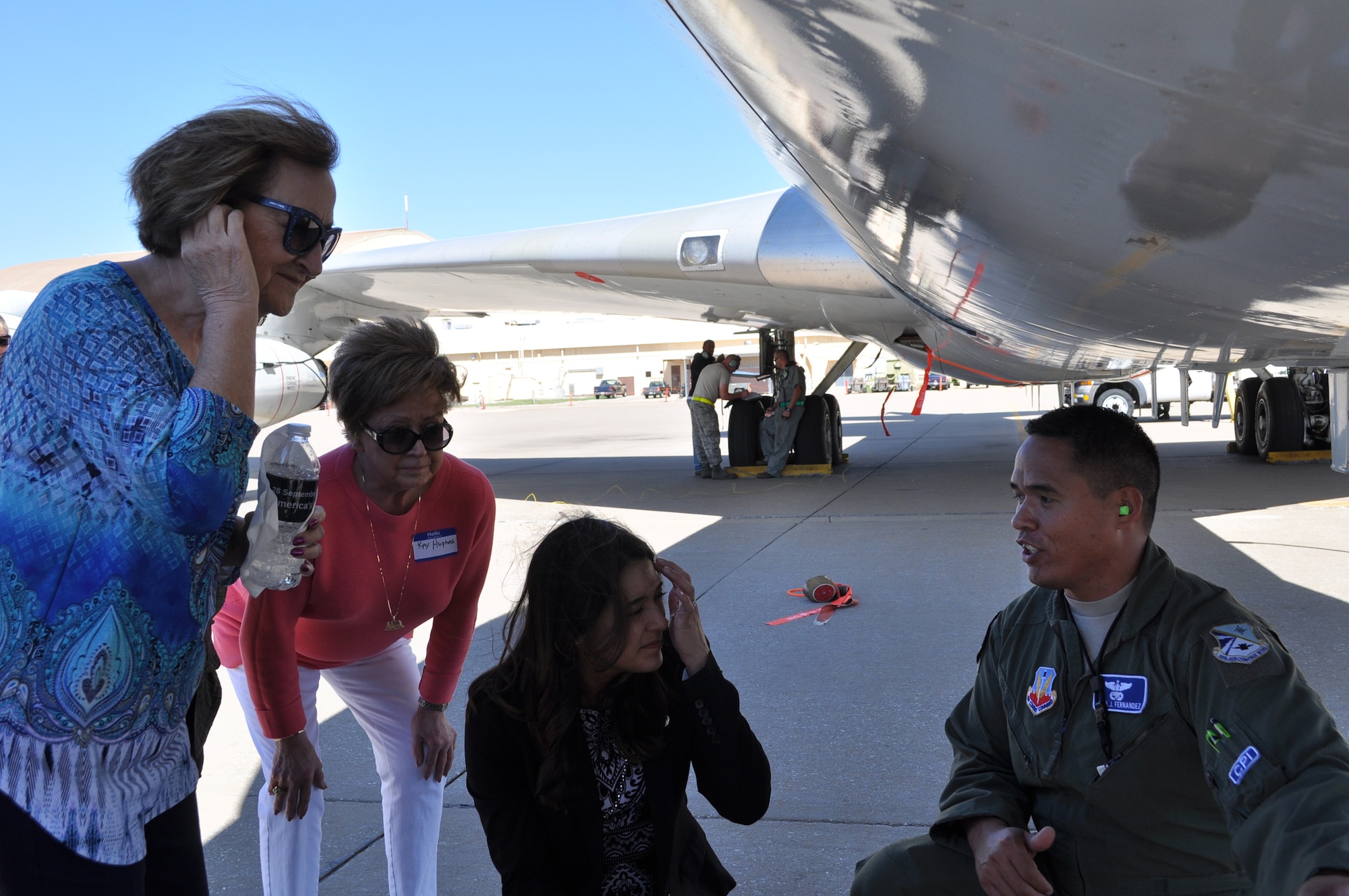 552nd Air Control Wing Honorary Commanders Sue Rogers, Kay Hughes and State Sen. Stephanie Bice listen as Tech. Sgt. Kamanu Fernandez, a flight engineer with the 960th Airborne Air Control Squadron, explains pre-flight procedures on the E-3 Sentry. The women were taking part in an honorary commander’s quarterly meeting held Sept. 28.    (Air Force photo by Ron Mullan) 