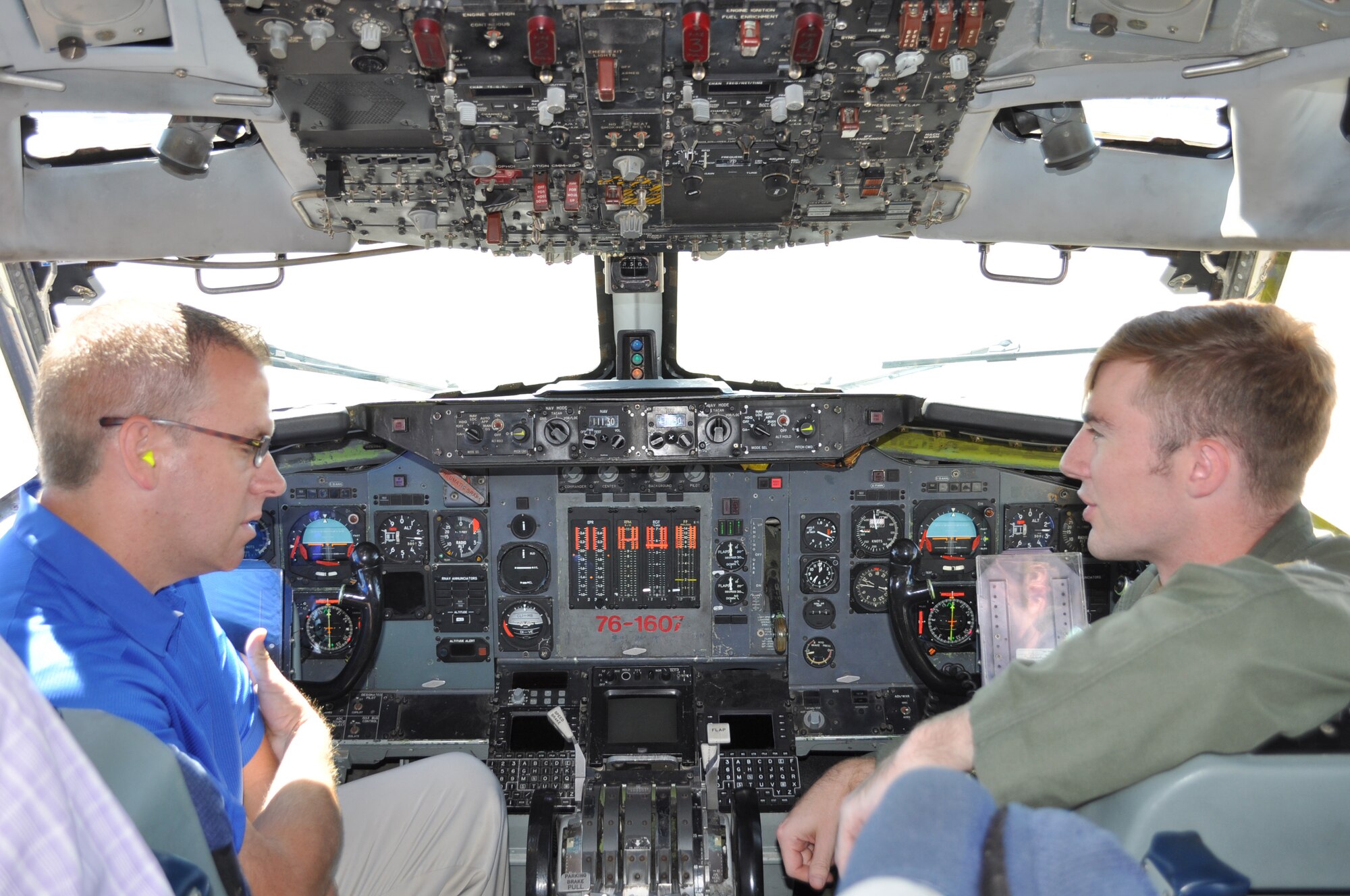 1st Lt Josh Archer, a pilot with the 960th Airborne Air Control Squadron, talks to 552nd Air Control Wing Honorary Commander Monty Strickland during a tour of the E-3 Sentry aircraft Sept. 28. (Air Force photo by Ron Mullan)