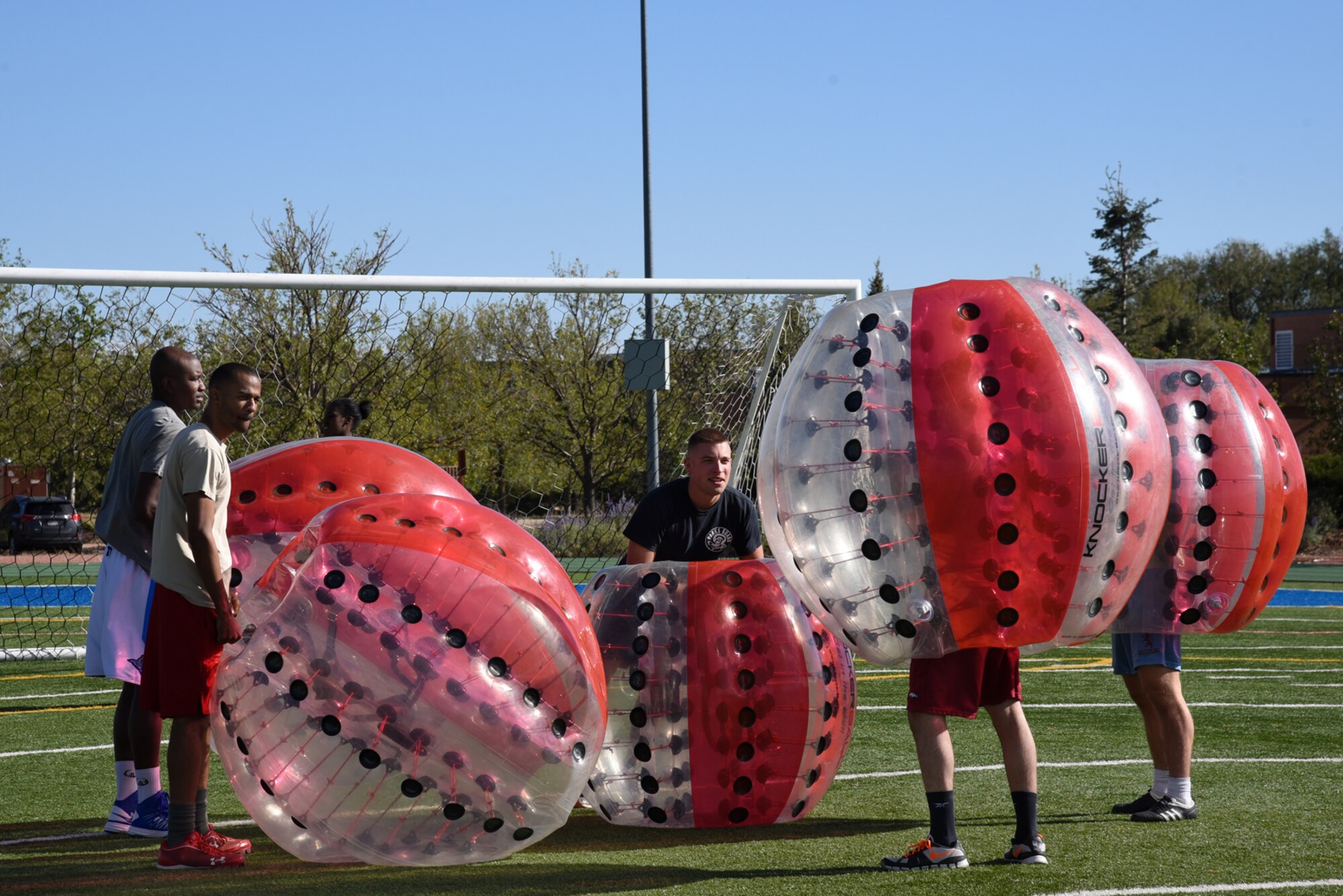 PETERSON AIR FORCE BASE, Colo. – Airmen suit up and wait for the official start to their game during a knockerball tournament at Peterson Air Force Base, Colo., Oct. 5, 2016. The tournament was part of the Peterson Combined Federal Campaign kickoff event. (U.S. Air Force photo by Airman 1st Class Dennis Hoffman)