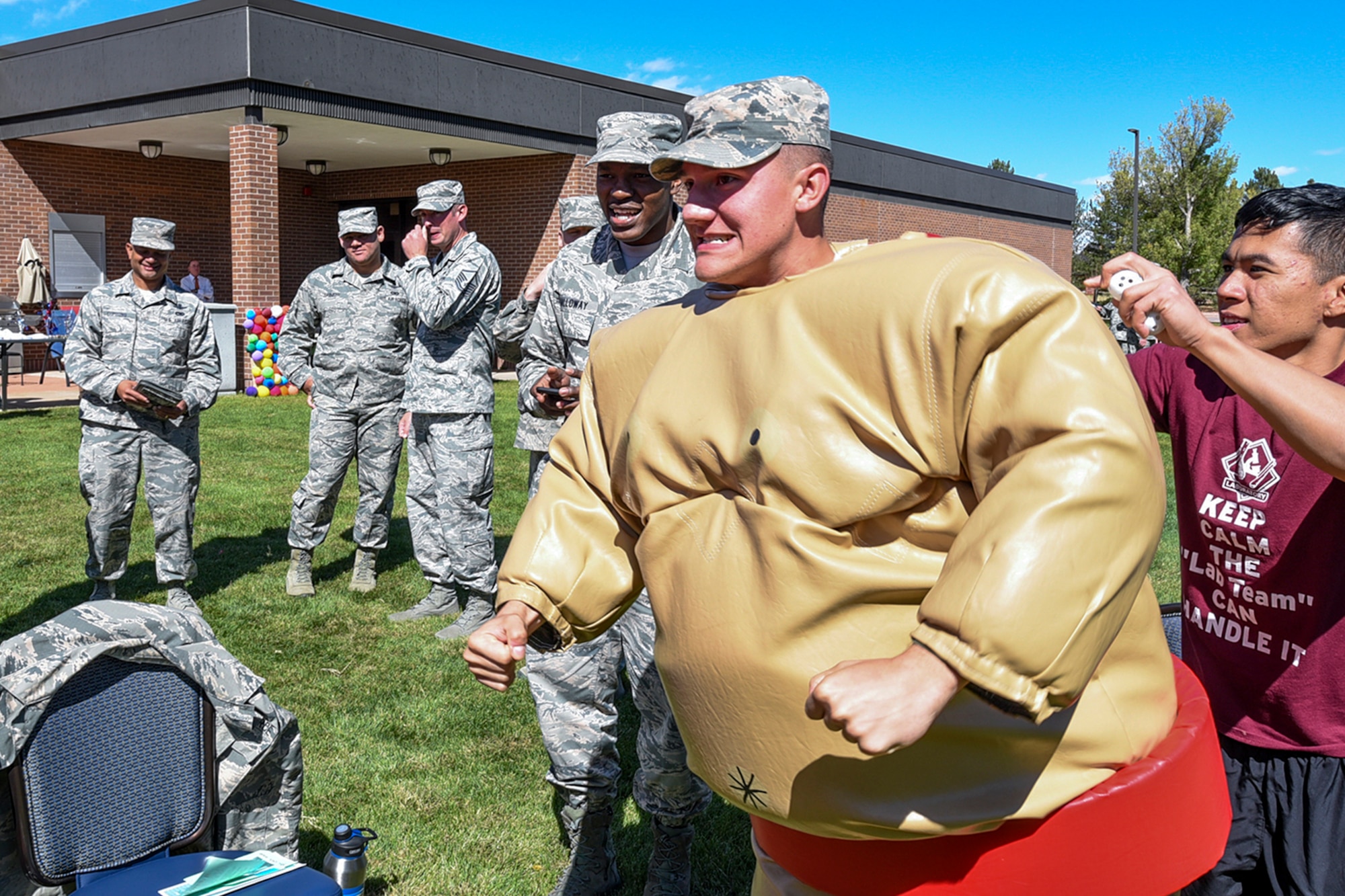 PETERSON AIR FORCE BASE, Colo. – Airman 1st Class Rhett Long, 21st Force Support Squadron, suits up for a sumo-wrestling contest as part of the Combined Federal Campaign at Peterson Air Force Base, Colo., Oct. 5, 2016. The 21st Space Wing annual CFC kickoff consisted of a carnival and information fair, which provided Airmen with general knowledge about different organizations to support. (U.S. Air Force photo by Philip Carter)