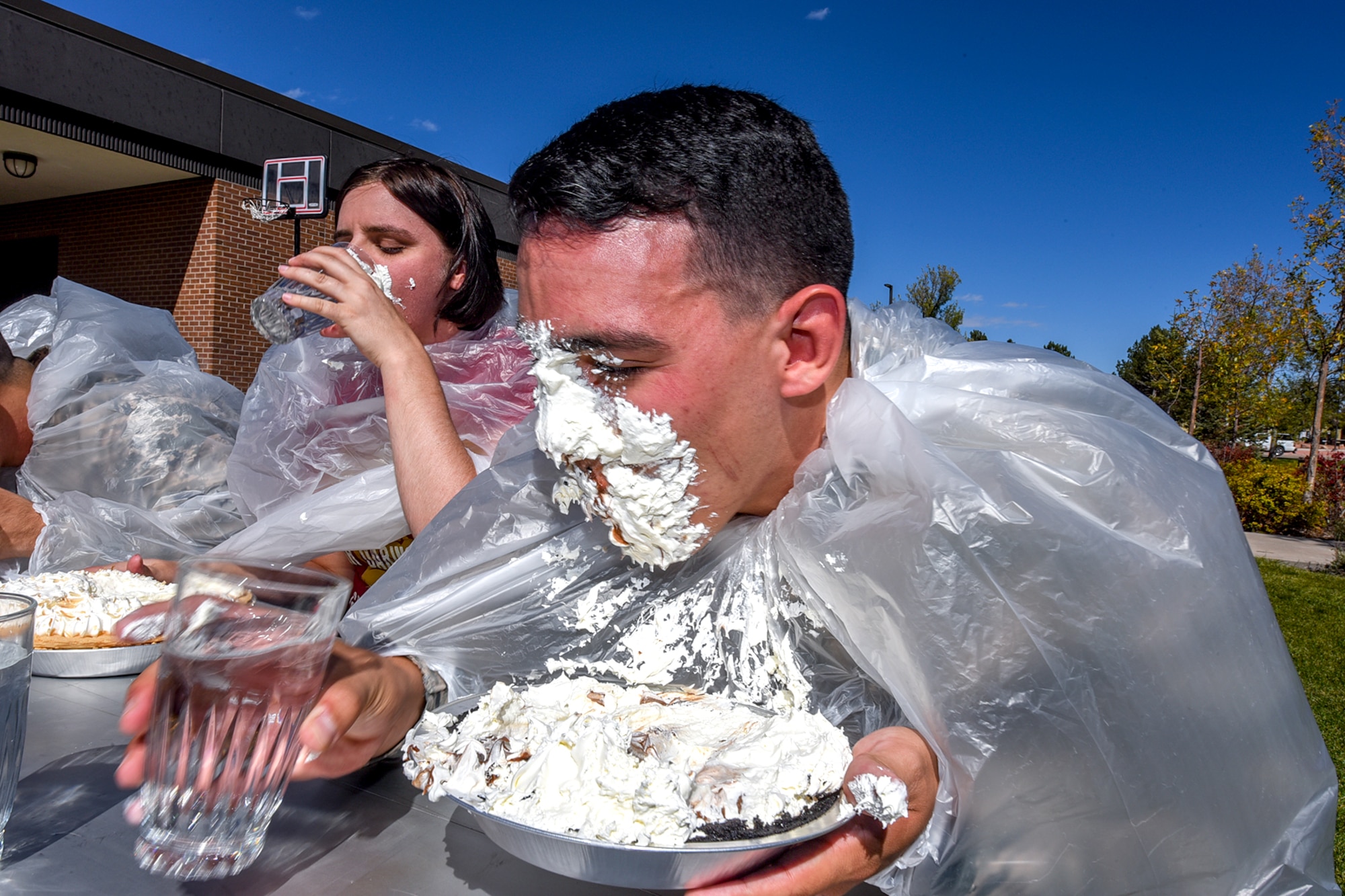 PETERSON AIR FORCE BASE, Colo. –Team Pete members participated in a pie-eating contest at part of the Combined Federal Campaign Kickoff Event at Peterson Air Force Base, Colo., Oct. 5, 2016. The 21st Space Wing annual CFC kickoff consisted of a carnival and information fair, which provided Airmen with general knowledge about different organizations to support. (U.S. Air Force photo by Philip Carter)