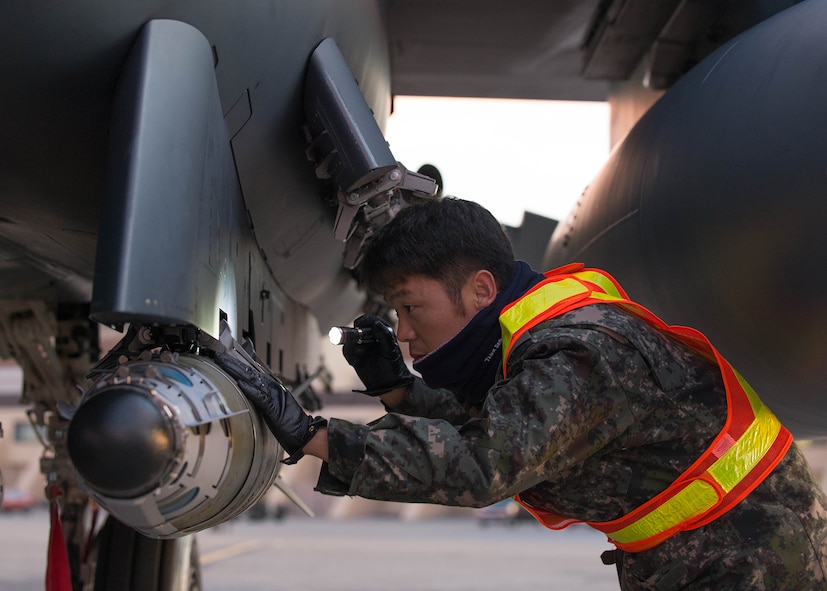 Republic of Korea Air Force weapons loading technician Senior Master Sgt. Lee You Dung conducts last minute checks on a laser guided GBU-54 bomb prior to testing it for the first time from an F-15K Slam Eagle fighter Oct. 11, 2016, during RED FLAG-Alaska (RF-A) 17-1 at Eielson Air Force Base, Alaska. RF-A is a Pacific Air Forces commander-directed field training exercise for U.S. and partner forces, enabling joint and international units to exchange tactics, techniques, and procedures while improving interoperability in a realistic threat environment. (U.S. Air Force photo by Staff Sgt. Shawn Nickel)
