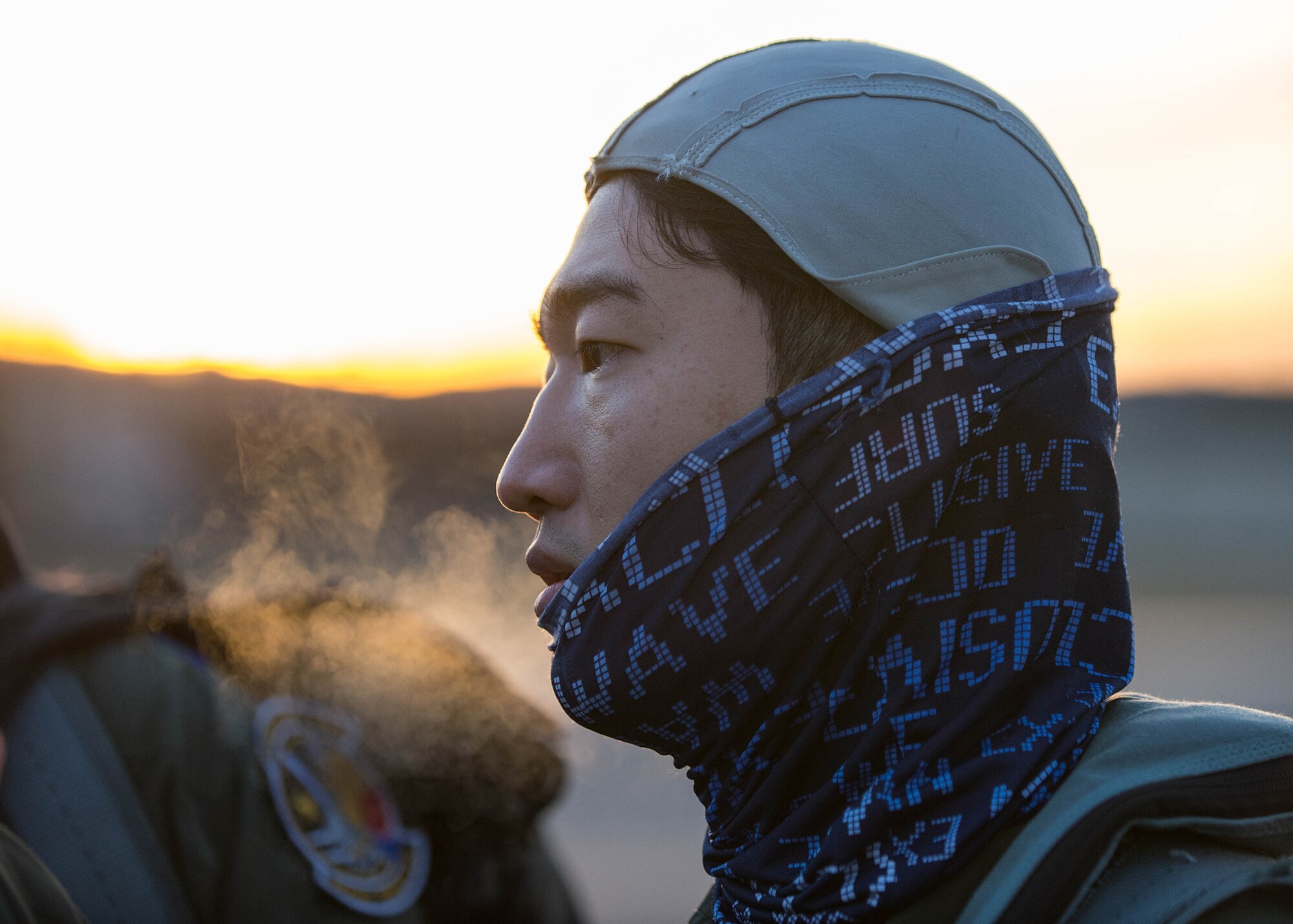 Republic of Korea Air Force F-15K Slam Eagle pilot Capt. Park You Min exhales into the 25 degree air while preparing for a mission Oct. 11, 2016, during RED FLAG-Alaska (RF-A) 17-1 at Eielson Air Force Base, Alaska. Min used a laser guided GBU-54 bomb for the first time on a ROKAF F-15K Slam Eagle fighter aircraft during the flight. Exercise scenarios occur within the Joint Pacific Alaska Range Complex, a more than 67,000 square mile airspace, with minimal impact on the environment. (U.S. Air Force photo by Staff Sgt. Shawn Nickel)

