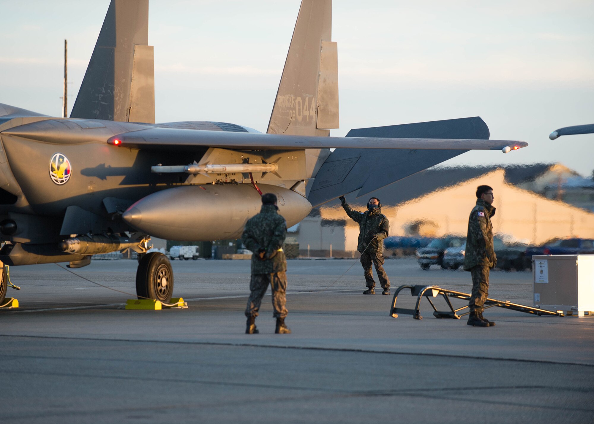 Maintenance airmen from the Republic of Korea Air Force conduct last minute function checks on an F-15K Slam Eagle fighter aircraft prior to a flight Oct. 11, 2016, during RED FLAG-Alaska (RF-A) 17-1 at Eielson Air Force Base, Alaska. RF-A provides training for deployed maintenance and support personnel in sustainment of large-force deployed air operations. (U.S. Air Force photo by Staff Sgt. Shawn Nickel)