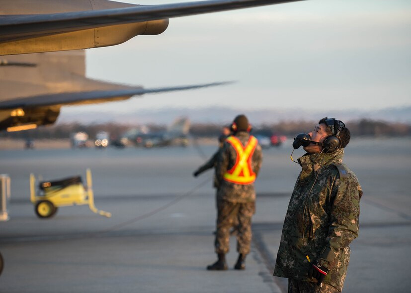Maintenance airmen from the Republic of Korea Air Force conduct last minute function checks on an F-15K Slam Eagle fighter aircraft prior to a flight Oct. 11, 2016, during RED FLAG-Alaska (RF-A) 17-1 at Eielson Air Force Base, Alaska. RF-A provides training for deployed maintenance and support personnel in sustainment of large-force deployed air operations. (U.S. Air Force photo by Staff Sgt. Shawn Nickel)
