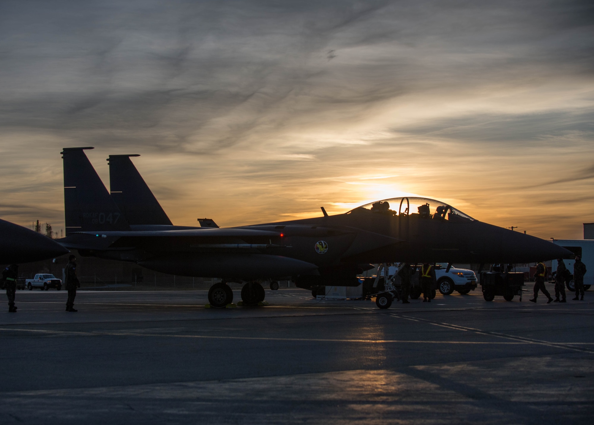 A Republic of Korea Air Force (ROKAF) F-15K Slam Eagle pilot and weapons officer start their jet for a mission Oct. 11, 2016, during RED FLAG-Alaska (RF-A) 17-1 at Eielson Air Force Base, Alaska. The aircrew used a laser guided GBU-54 bomb for the first time on a ROKAF F-15K. Exercise scenarios occur within the Joint Pacific Alaska Range Complex, a more than 67,000 square mile airspace, with minimal impact on the environment. (U.S. Air Force photo by Staff Sgt. Shawn Nickel)
