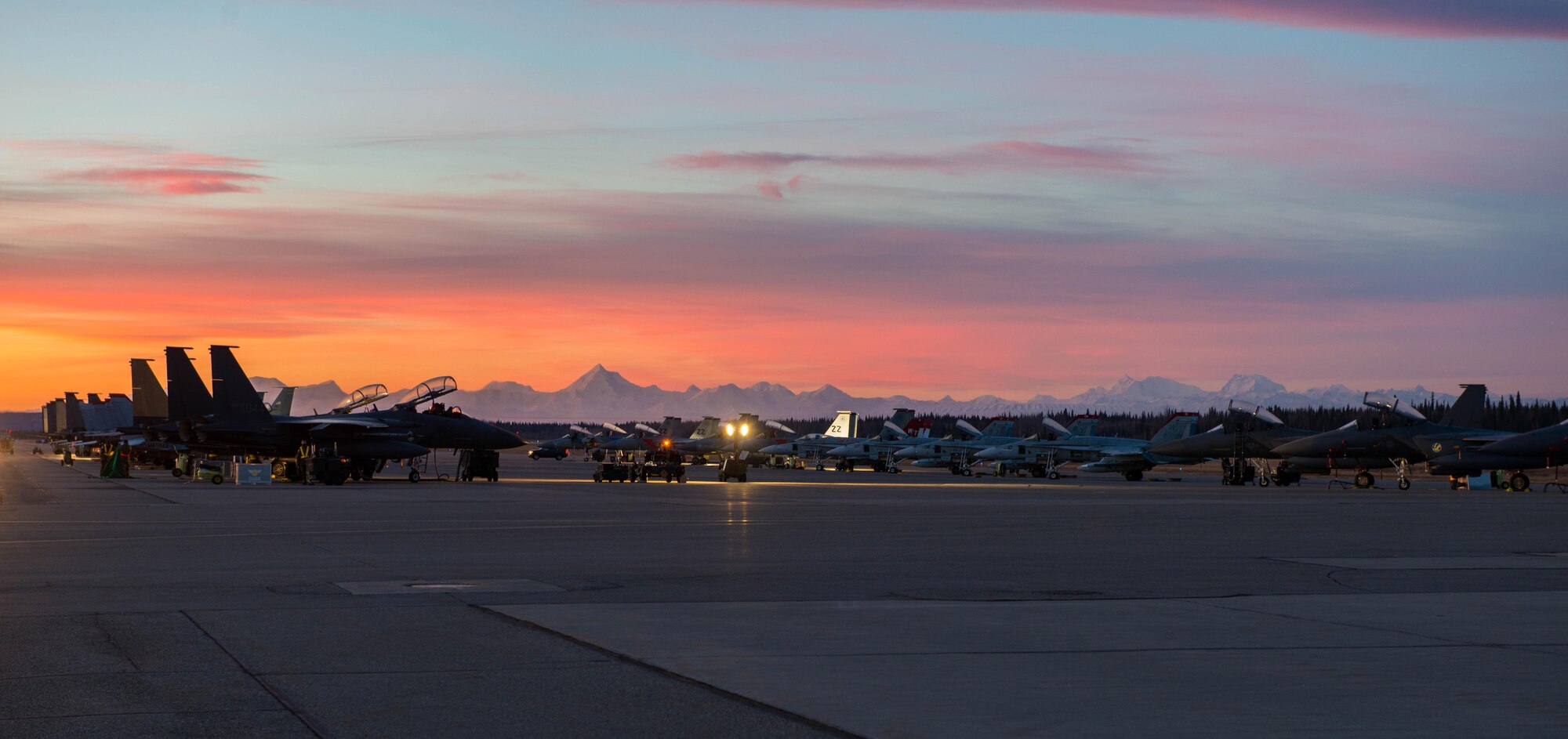 Republic of Korea F-15K Slam Eagle fighter aircraft and F-A18C Hornet fighter and attack jets from Marine Fighter Attack Squadron 232, Marine Corps Air Station Miramar, Calif., are prepared for a sortie Oct. 11, 2016, during RED FLAG-Alaska (RF-A) 17-1 at Eielson Air Force Base, Alaska. RF-A provides unique opportunities to integrate various forces into joint, coalition and multilateral training from simulated forward operating bases. (U.S. Air Force photo by Staff Sgt. Shawn Nickel)
