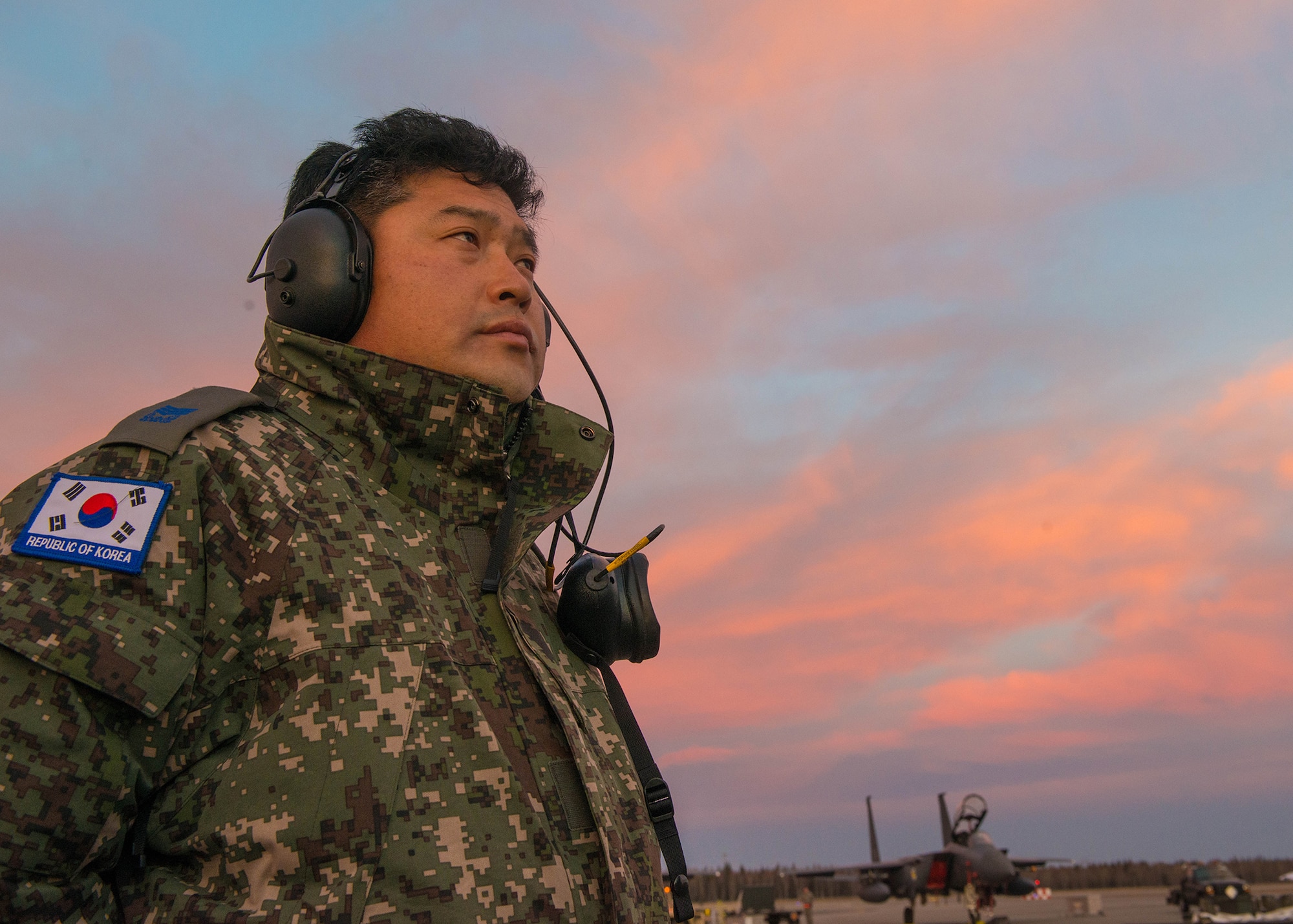 A maintenance airman with the Republic of Korea Air Force supervises as an F-15K Slam Eagle fighter aircraft is prepared for take off Oct. 11, 2016, during RED FLAG-Alaska (RF-A) 17-1 at Eielson Air Force Base, Alaska. This Pacific Air Forces commander-directed exercise is vital to maintaining peace and stability in the Indo-Asia-Pacific region. (U.S. Air Force photo by Staff Sgt. Shawn Nickel)