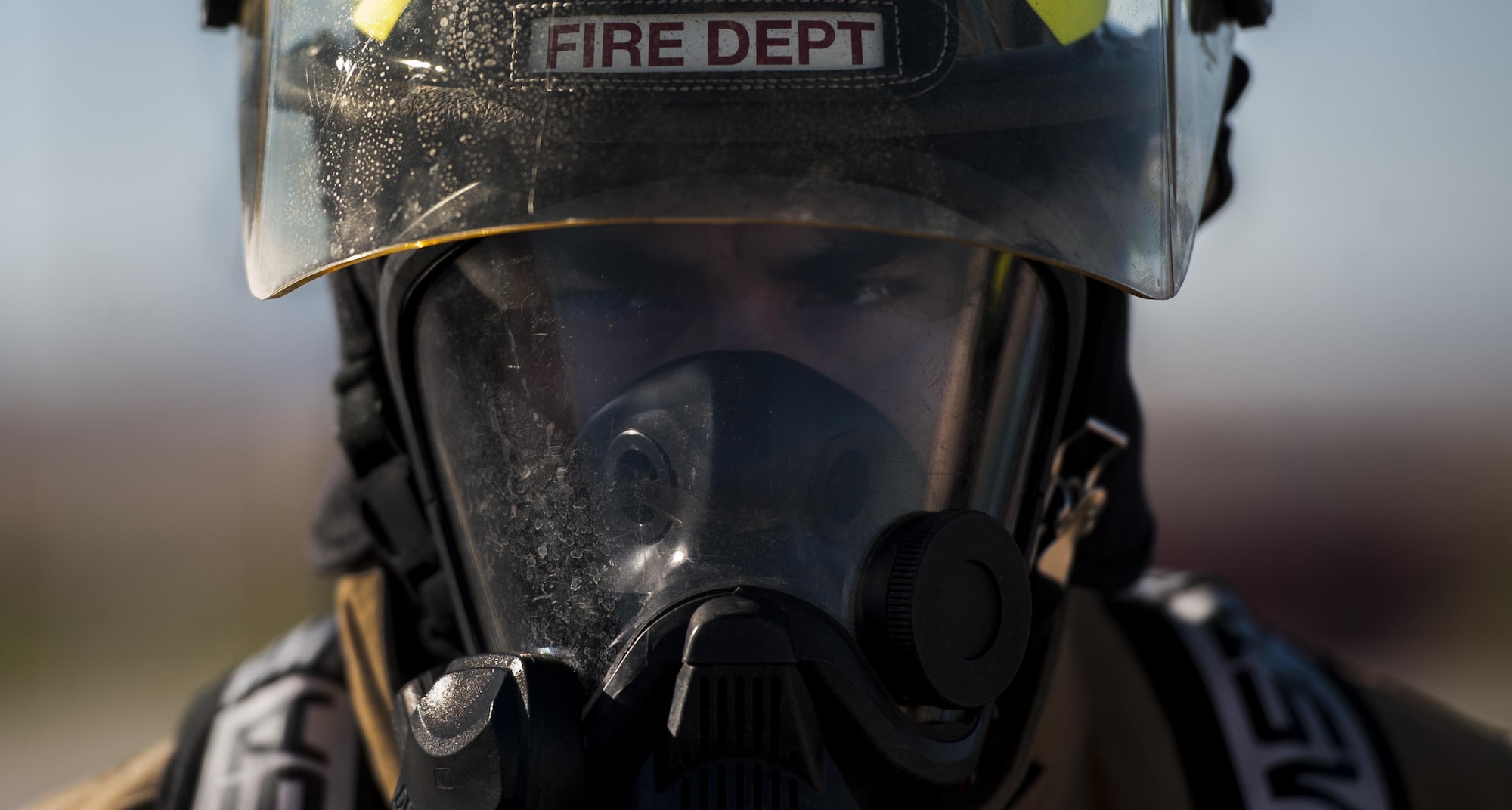 Senior Airman James Avdoian-Salas, 99th Civil Engineer Squadron Fire Protection Flight firefighter, prepares before controlled burn training at Nellis Air Force Base, Nev., Oct. 6, 2016. Fire Prevention Week serves as an opportunity for the NCFD to present a fire safety message to help keep the people that live and work on Nellis and Creech safe. (U.S. Air Force photo by Airman 1st Class Kevin Tanenbaum/Released)