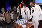151017-N-HW977-635 RIVERSIDE, Calif. (Oct. 17, 2015) Logistics Specialist 1st Class Kenneth Limerick, right, and Electronics Technician 3rd Class Brandyn Webb cut cake during the inaugural Inland Empire Navy Birthday Ball. The sold-out event, to commemorate the Navy's 240th birthday, included dinner, ceremonies, music, dancing and a keynote address by U.S. Representative Ken Calvert (R-Corona). All proceeds will benefit the Navy-Marine Corps Relief Society. (U.S. Navy photo by Greg Vojtko/Released)