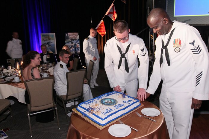 151017-N-HW977-635 RIVERSIDE, Calif. (Oct. 17, 2015) Logistics Specialist 1st Class Kenneth Limerick, right, and Electronics Technician 3rd Class Brandyn Webb cut cake during the inaugural Inland Empire Navy Birthday Ball. The sold-out event, to commemorate the Navy's 240th birthday, included dinner, ceremonies, music, dancing and a keynote address by U.S. Representative Ken Calvert (R-Corona). All proceeds will benefit the Navy-Marine Corps Relief Society. (U.S. Navy photo by Greg Vojtko/Released)