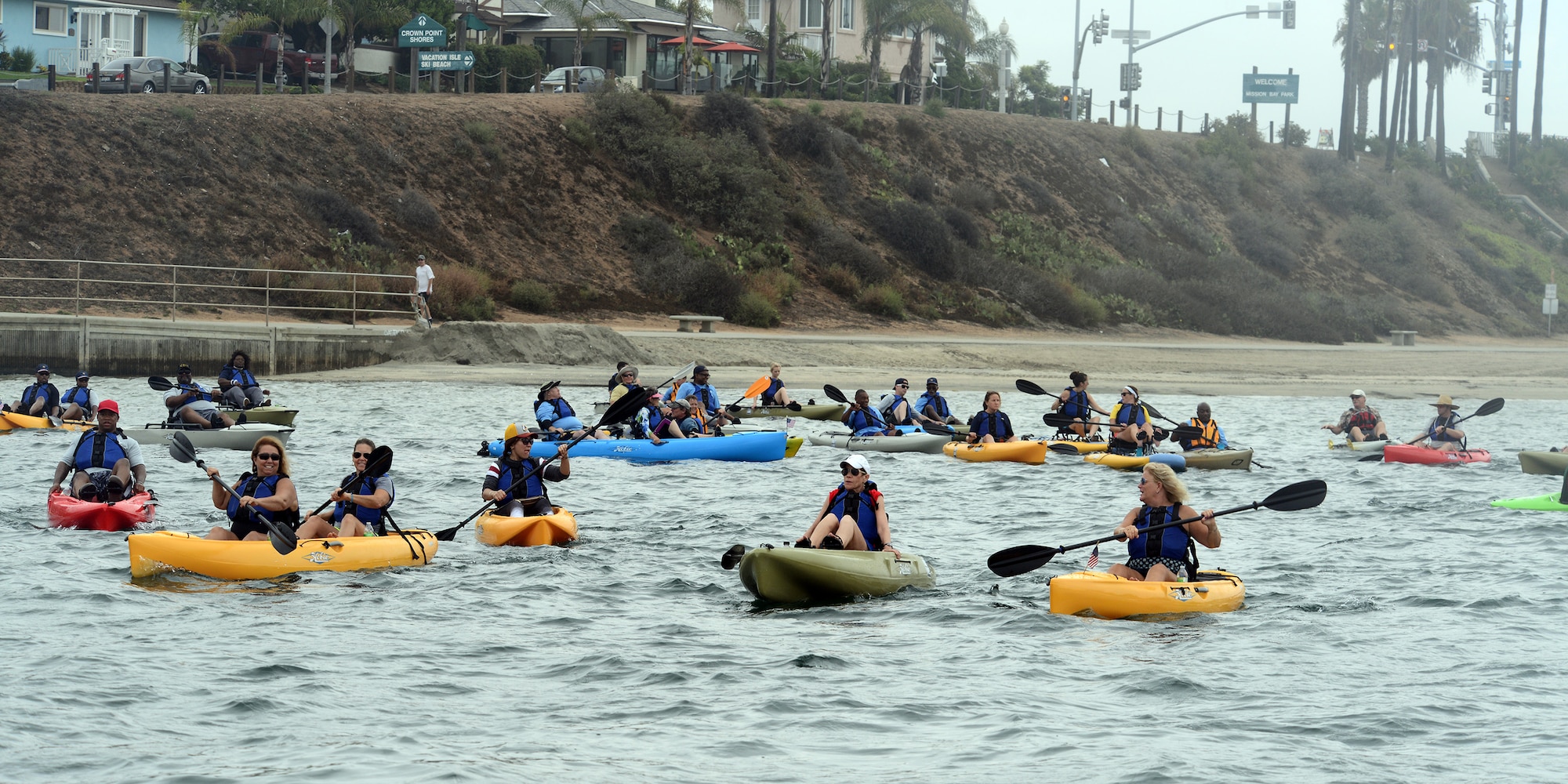 Veterans kayak through the Mission Valley river during the National Veterans Summer Sports Clinic Sept. 21, 2016 at San Diego, Ca. The clinic provided opportunities for veterans to learn adaptive surfing, sailing, cycling, kayaking, rowing, judo and archery. (U.S. Air Force photo by Senior Airman Devante Williams)