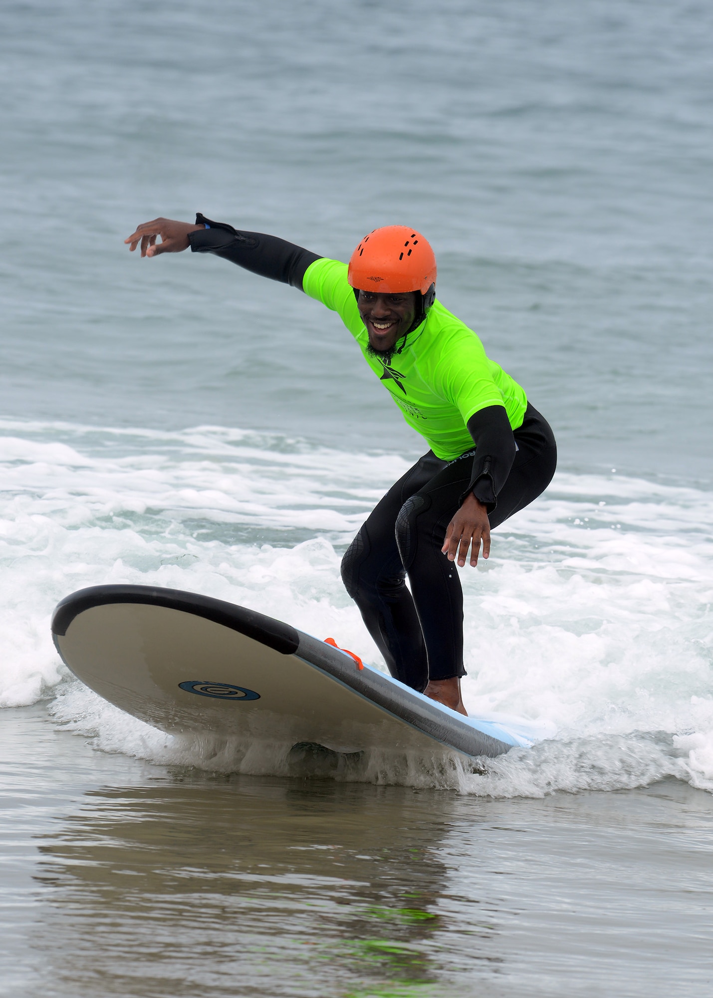Retired Navy Petty Officer Third Class Karoy Campbell surfs during the National Disabled Veterans Summer Sports Clinic Sept. 19, 2016 at San Diego, Ca. The clinic gave veterans an opportunity to challenge themselves through education and recreational activities. Rehabilitation was promoted using summer sporting activities such as surfing, archery, sailing, kayaking, cycling and rowing.(U.S. Air Force photo by Senior Airman Devante Williams)