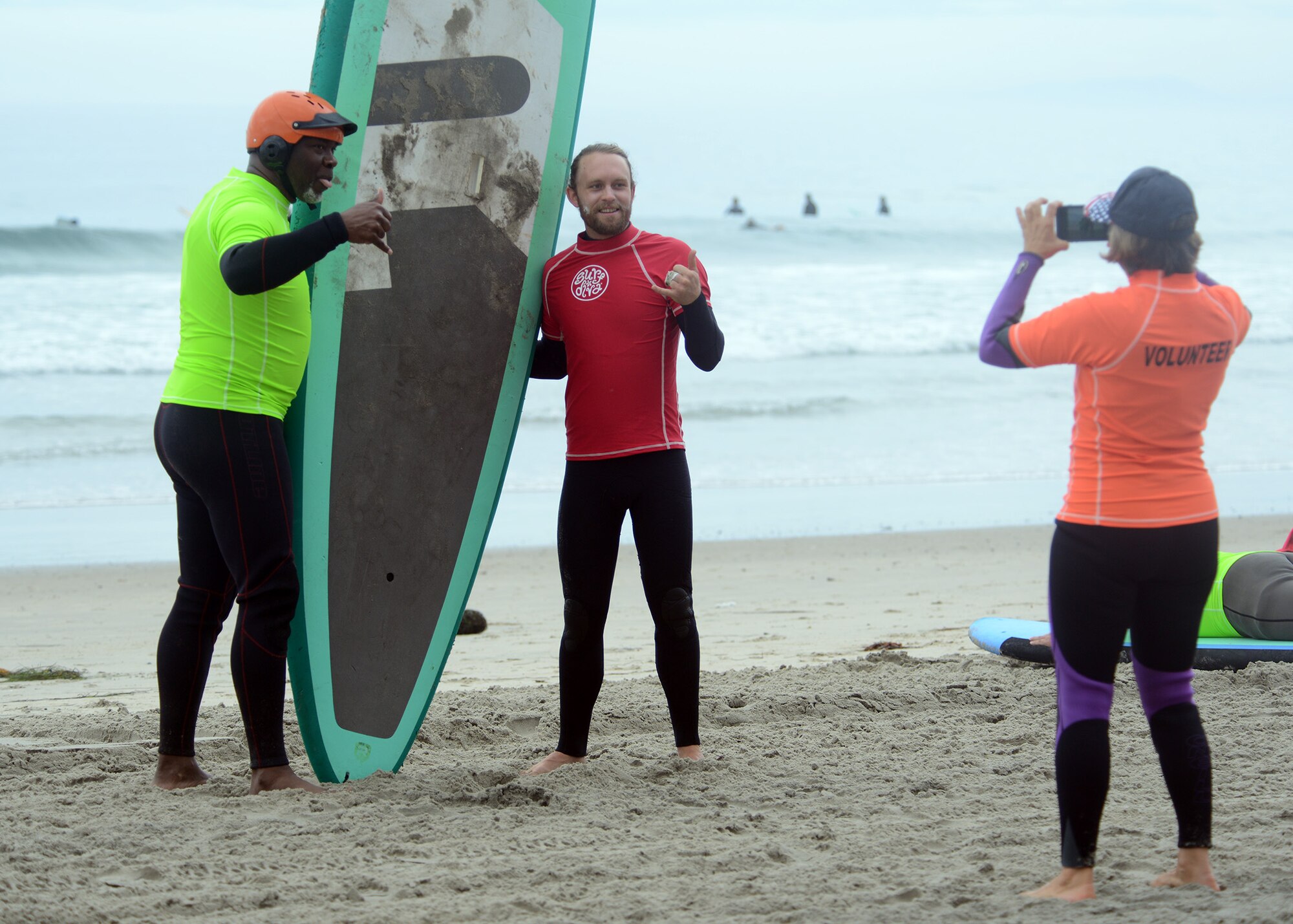 Veterans and staff take time out to pose for a photo during the National Veterans Summer Sports Clinic Sept. 21, 2016 at San Diego, Ca. The clinic provided opportunities for veterans to learn adaptive surfing, sailing, cycling, kayaking, rowing, judo and archery. (U.S. Air Force photo by Senior Airman Devante Williams)