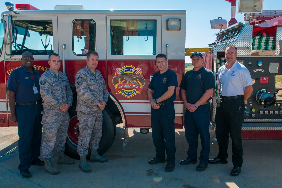 Members of the 187th Fighter Wing fire department pose with the department’s new Pierce Structural Pumper October 6, 2016, at the Montgomery Regional Air National Guard Base. The new pumper enhances the department’s capabilities to fight structural fires. (U.S. Air National Guard photo by Staff Sergeant Jared Rand)
