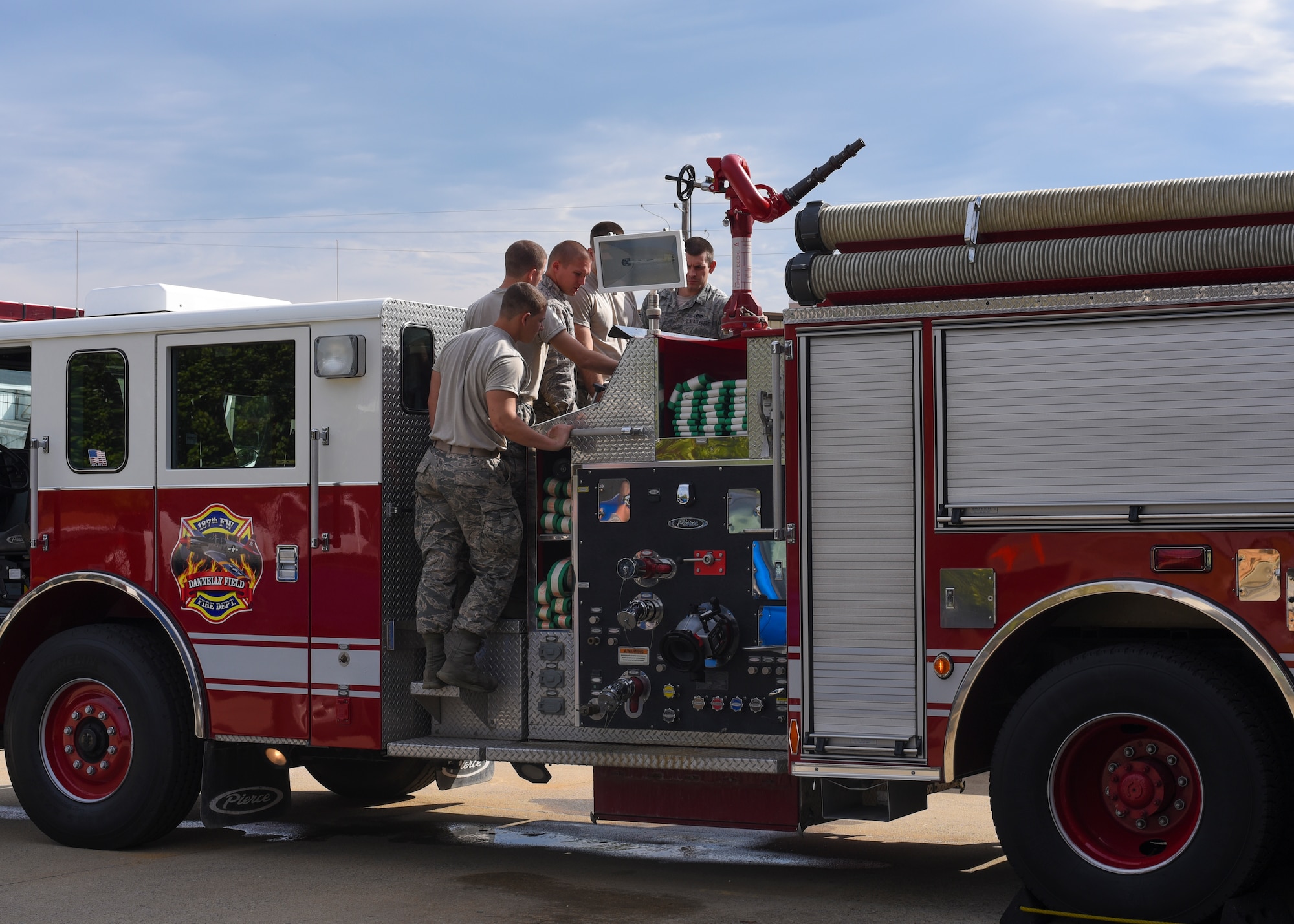 187th Fighter Wing firefighters train on the fire department’s new Pierce Structural Pumper October 2, 2016, at the Montgomery Regional Air National Guard Base. The new pumper enhances the department’s capabilities to fight structural fires. (U.S. Air National Guard photo by Airman First Class Hayden Johnson)