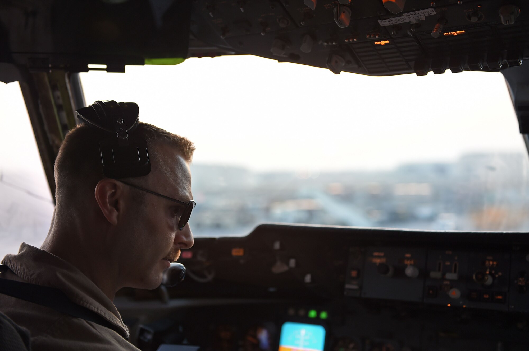 Capt. Justin, 908th Expeditionary Air Refueling Squadron pilot, conducts pre-flight checks on his KC-10 prior to a refueling mission at an undisclosed location in Southwest Asia, Oct. 9, 2016. Justin checks to make sure that all flight controls and displays are functioning correctly before moving his aircraft to the runway. (U.S. Air Force photo by Tech. Sgt. Christopher Carwile)