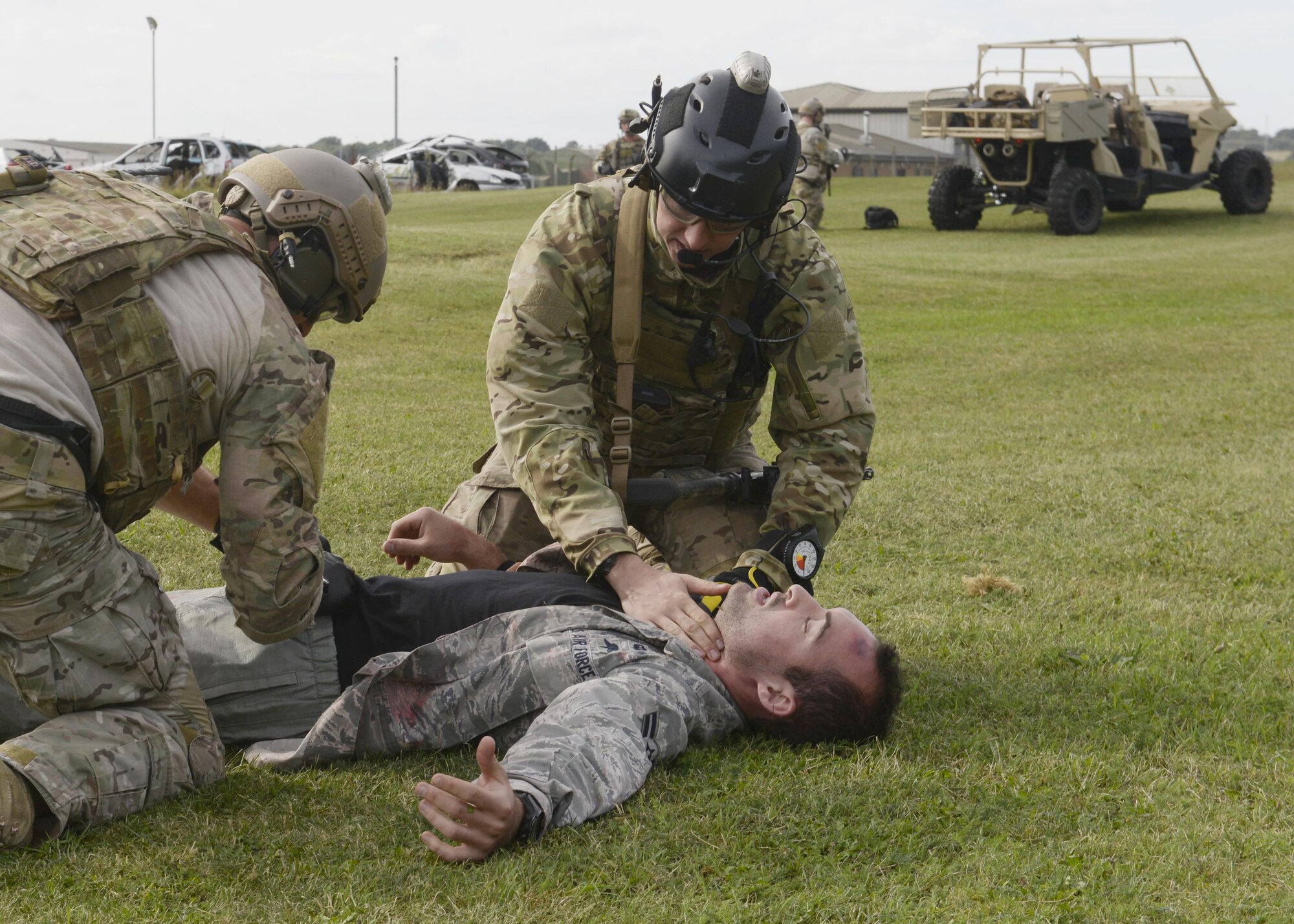 U.S. Air Force pararescuemen assigned to the 57th Rescue Squadron check a patient during a training exercise at Royal Air Force Lakenheath, England, Sept. 30. Members of the 57th RQS demonstrated their life-saving skills in a simulated deployed environment. (U.S. Air Force photo/Airman 1st Class Abby L. Finkel)