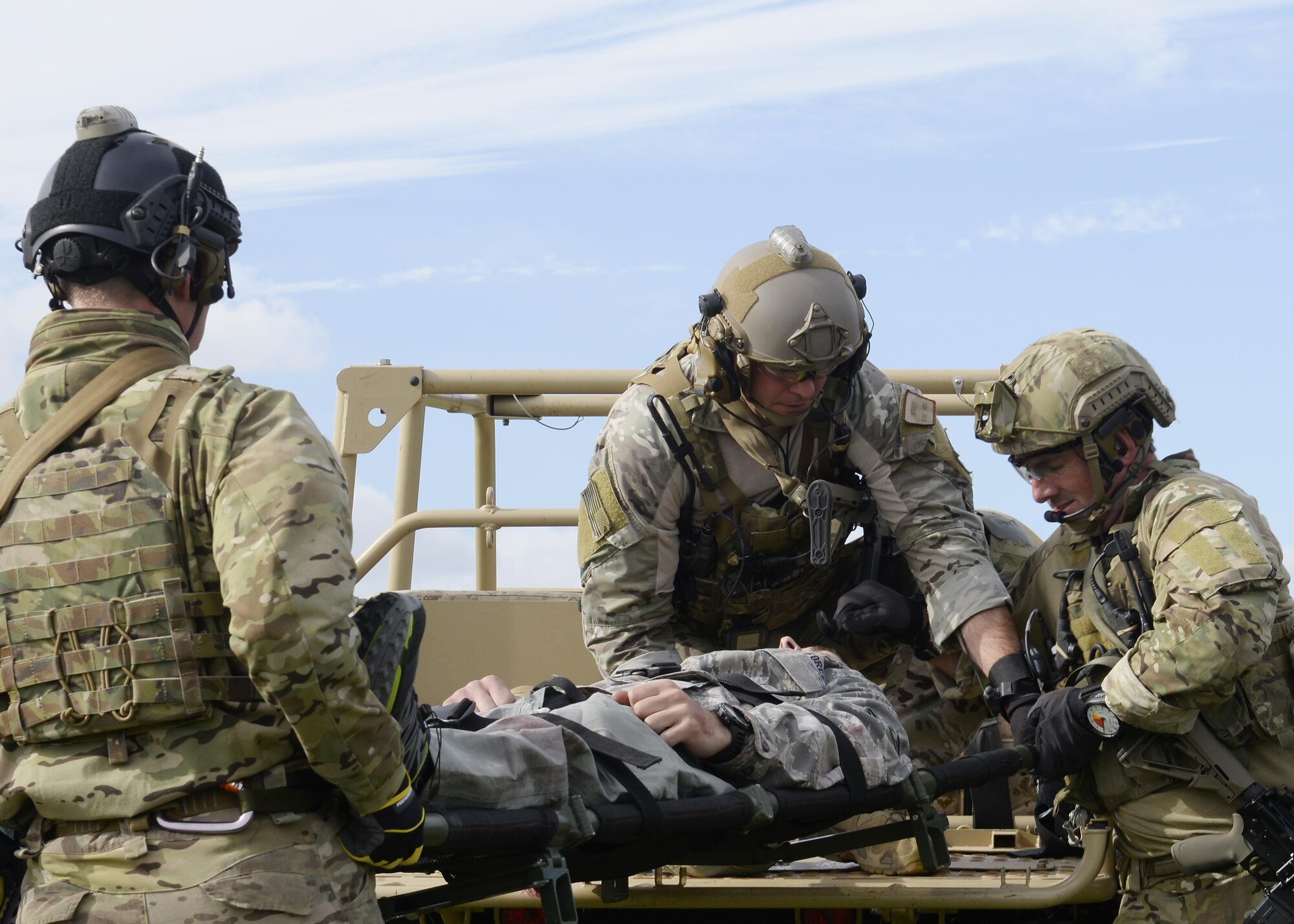 U.S. Air Force pararescuemen assigned to the 57th Rescue Squadron load a patient onto a vehicle during a training exercise at Royal Air Force Lakenheath, England, Sept. 30. Members of the 57th RQS demonstrated their life-saving skills in a simulated deployed environment. (U.S. Air Force photo/Airman 1st Class Abby L. Finkel)
