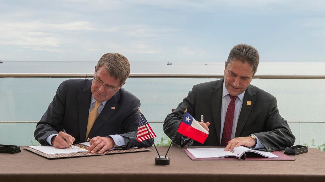 Defense Secretary Ash Carter signs an agreement with Chilean National Defense Minister Jose Gomez during the Conference of Defense Ministers of the Americas in Port-of-Spain, Trinidad and Tobago, Oct. 11, 2016. The agreement will expand cooperation between the two countries on defense technology. DoD photo by Air Force Tech. Sgt. Brigitte N. Brantley