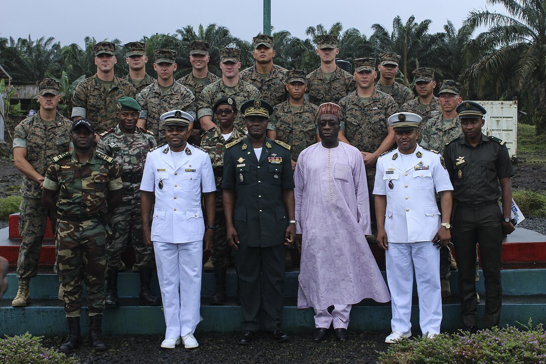 Marines with Special Purpose Marine Air-Ground Task Force Crisis Response-Africa stand for a group photo with Cameroonian officials in Limbé, Cameroon, Aug. 29, 2016. Marines trained on small unit tactics, weapons handling, orders processing and detainee handling with the FORFUMAPCO soldiers to combat illicit trafficking in the region. - U.S. Marines and Sailors assigned to Special Purpose Marine Air-Ground Task Force-Crisis Response-Africa Command support operations, contingencies and security cooperation in the U.S. Africa Command area of responsibility. (U.S. Marine Corps courtesy photo)