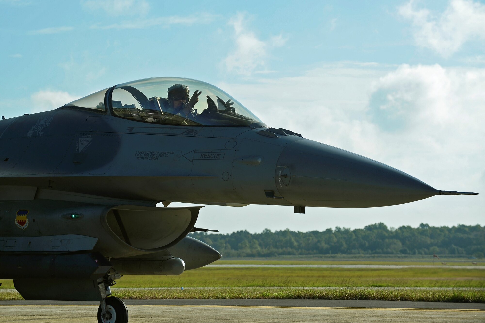 An F-16CM Fighting Falcon pilot assigned to the 20th Fighter Wing taxis in preparation for takeoff at Shaw Air Force Base, S.C., Oct. 6, 2016. Nearly 50 aircraft were evacuated from Shaw in anticipation of Hurricane Matthew, while the remainder were stored inside various hangars to keep them safe. (U.S. Air Force photo by Airman BrieAnna Stillman)