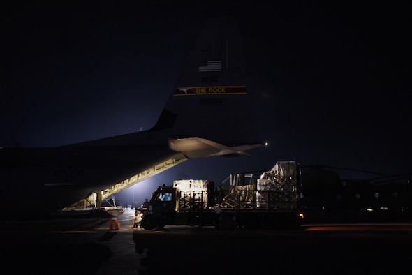 Supplies housed at Joint Base McGuire-Dix-Lakehurst, N.J., are offloaded from a Little Rock Air Force Base, Ark., C-130J Oct. 8, 2016, in Port-au-Prince, Haiti. By using airlift capabilities, the two Air Mobility Command bases partnered together to quickly and safely deliver relief to the people of Haiti. (U.S. Air Force photo by Senior Airman Mercedes Taylor)  