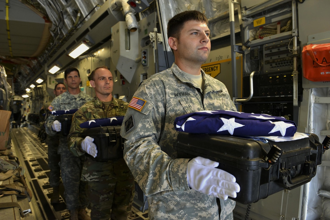 A detail of Defense POW/MIA Accounting Agency (DPAA) personnel carry cases containing possible remains of unidentified Service members during a dignified transfer Joint Base Pearl Harbor-Hickam, Hawaii, June 16, 2016. The remains, recently repatriated from Laos by DPAA recovery teams, will be examined by forensic anthropologists and forensic odontologists at DPAA’s skeletal identification laboratory. DPAA conducts global search, recovery and laboratory operations to provide the fullest possible accounting for our missing personnel to their families and the nation. 