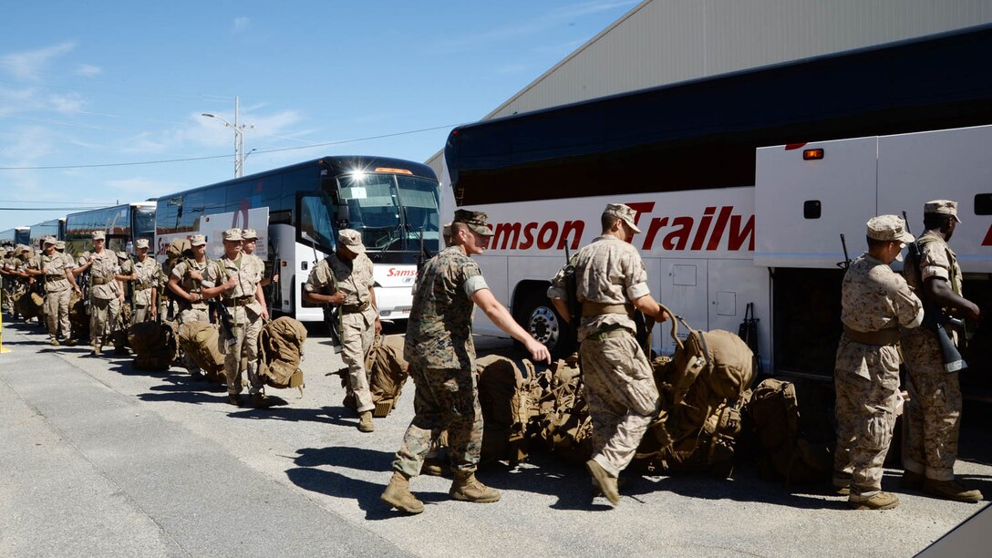 Recruits load buses with gear at Marine Corps Logistics Base Albany, Georgia, as they prepare to return to Marine Corps Recruit Depot Parris Island, S.C., Oct. 11. More than 6,000 recruits and permanent personnel from Parris Island evacuated from the training depot on Oct. 5 to avoid destructive weather expected from Hurricane Matthew. 