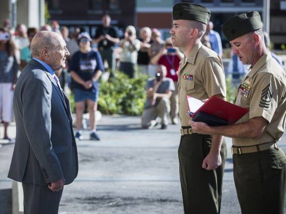 On September 21, 2016, Marines from the Inspector-Instructor Staff of Indianapolis had the honor and privilege of presenting the Purple Heart Medal to WWII veteran, Pfc. Junior E. Howell, for wounds sustained during the Battle of Peleliu on Sept. 21, 1944. Howell is one of the last living WWII veterans to receive the Purple Heart. More than 100 friends and family members were in attendance to watch him receive the medal 72 years to the day after he was wounded in combat. (Photos courtesy of 4th Marine Division.)