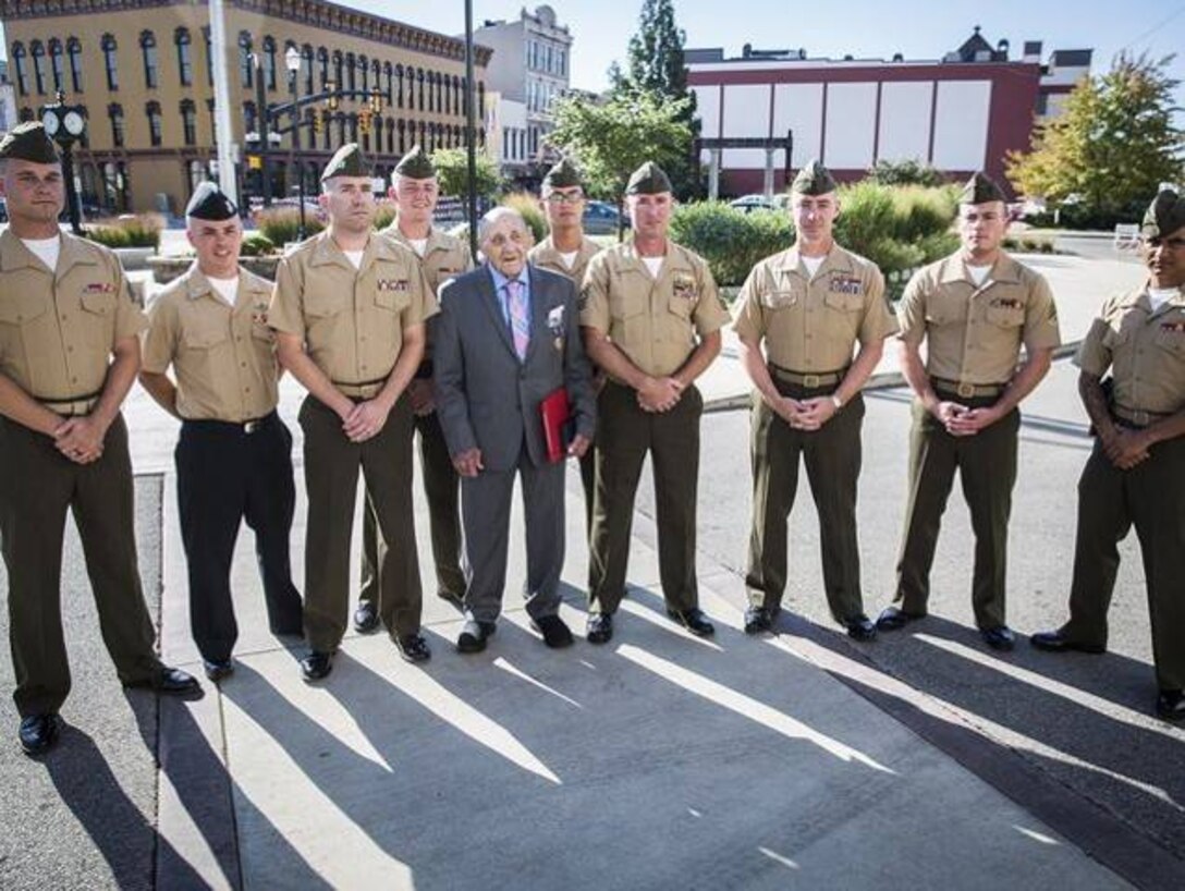 On September 21, 2016, Marines from the Inspector-Instructor Staff of Indianapolis had the honor and privilege of presenting the Purple Heart Medal to WWII veteran, Pfc. Junior E. Howell, for wounds sustained during the Battle of Peleliu on Sept. 21, 1944. Howell is one of the last living WWII veterans to receive the Purple Heart. More than 100 friends and family members were in attendance to watch him receive the medal 72 years to the day after he was wounded in combat. (Photos courtesy of 4th Marine Division.)