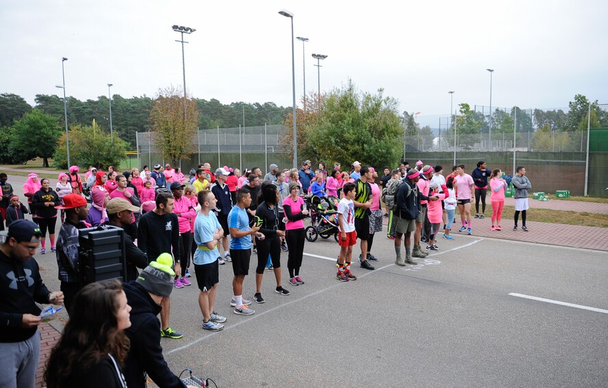 Runners line up before a breast cancer awareness 5 km run at Ramstein Air Base, Germany, Oct. 8, 2016. The route the runners took was supplied with more than 40 volunteers for the event. (U.S. Air Force photo by Airman 1st Class Savannah L. Waters)