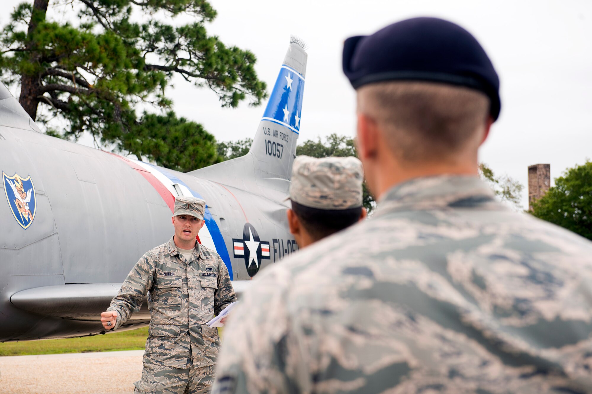 U.S. Air Force 2nd Lt. Ryan Noblin, 75th Aircraft Maintenance Unit officer in charge, briefs Airmen about various static displays in the President George W. Bush Airpark, Oct. 6, 2016, at Moody Air Force Base, Ga. The briefing focused on the maintenance innovations through the years on Moody’s aircraft from the Curtiss P-40 Warhawk to the A-10C Thunderbolt II. (U.S. Air Force photo by Airman 1st Class Greg Nash)