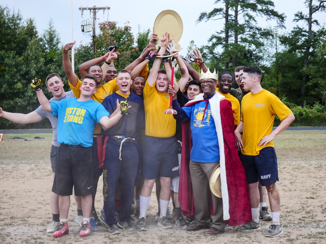 The sea service student team accepts the Toilet Bowl Award for winning the Defense Information School’s 2015 Toilet Bowl, at Mullins Field, Fort Meade, Md., Sept 25, 2015. The sea service team conquered the air-land team 20 to 6.