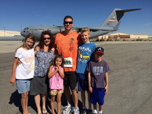 U.S. Air Force Chief Master Sgt. Kennon Arnold, 633rd Air Base Wing command chief, his wife and children pose for a photo after a run. Arnold intends to bring his family values to Joint Base Langley-Eustis, Va., to help service members see each other as brothers and sisters in arms to ensure mission success. (Courtesy photo)