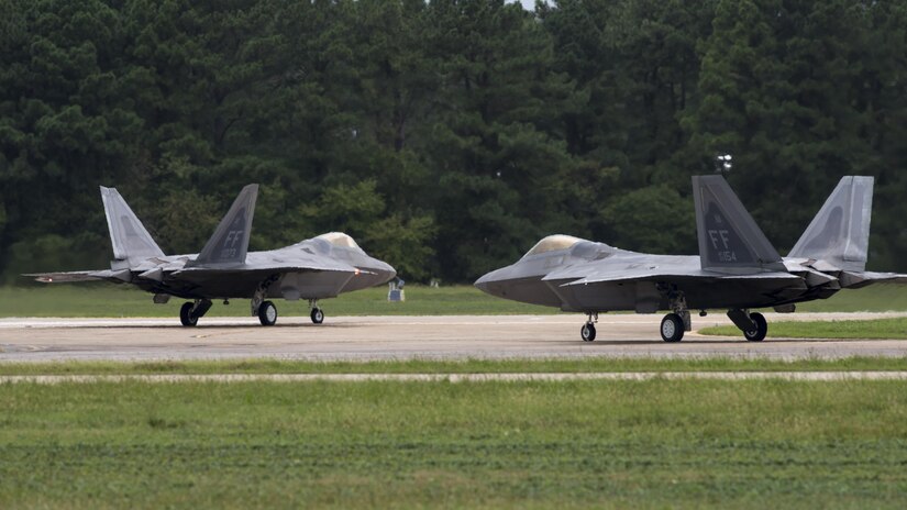 U.S. Air Force F-22 Raptors take off from the runway at Joint Base Langley-Eustis, Va., Oct. 5, 2016. Aircraft were evacuated from the installation in preparation for projected tidal surges and potential flooding as a result of Hurricane Matthew. (U.S. Air Force photo by Staff Sgt. J.D. Strong II)