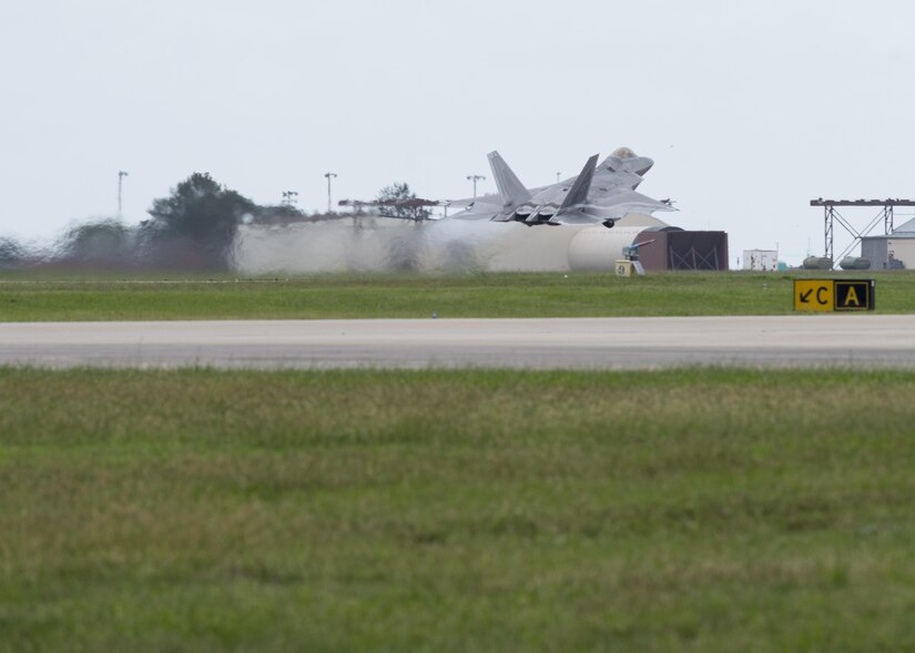 An U.S. Air Force F-22 Raptor takes off from the runway at Joint Base Langley-Eustis, Va., Oct. 5, 2016. Approximately 40 aircraft and 100 personnel from the 1st and 192nd Fighter Wing evacuated the installation due to projected tidal surges and potential flooding as a result of Hurricane Matthew. (U.S. Air Force photo by Staff Sgt. J.D. Strong II)