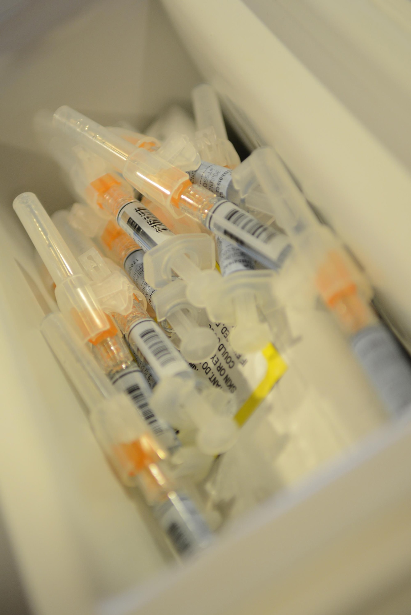 Influenza vaccinations lay in a bin on Laughlin Air Force Base, Texas, Oct. 4, 2016. Influenza, the flu, is a world-wide contagious disease that spreads throughout the U.S. every winter, with peak season between October and May. (U.S. Air Force photo/Senior Airman Ariel D. Partlow)