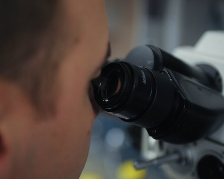 Staff Sgt. David Eley, 2nd Medical Support Squadron laboratory technician, examines a test sample at Barksdale Air Force Base, La., Sept. 22, 2016. The medical lab didn't have any deficiencies during their inspection from the college of American Pathologists. (U.S. Air Force photo/Airman 1st Class Stuart Bright)