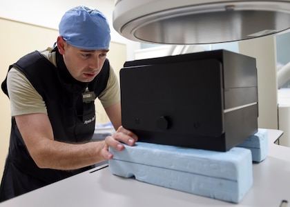 Maj. David Winter, 59th Medical Wing Radiology Subspecialty Flight commander, sets up a patient equivalent phantom on a fluoroscopy table June 16 at Wilford Hall Ambulatory Surgical Center at Joint Base San Antonio-Lackland.