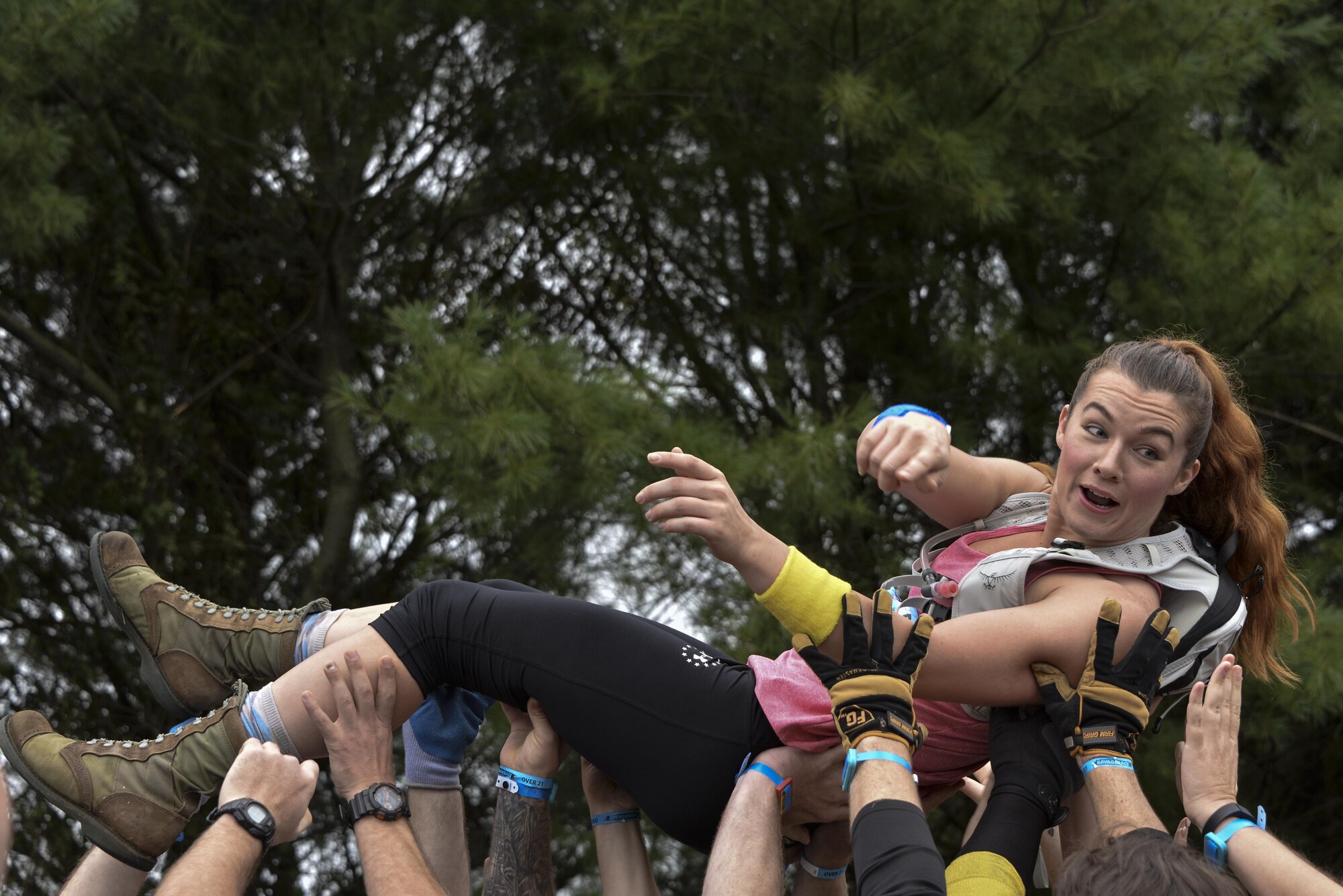 Staff Sgt. Marissa Strickland, 70th Operations Support Squadron, crowd-surfs during the opening ceremony of the 2016 Savage Race October 8, 2016 at Kennedyville, Md. 70th ISRW participants endured a seven-mile obstacle course of cargo net walls, creeks, ice cold water and climbing to test their stamina and strength as a team. (U.S. Air Force photo/Staff Sgt. Alexandre Montes)